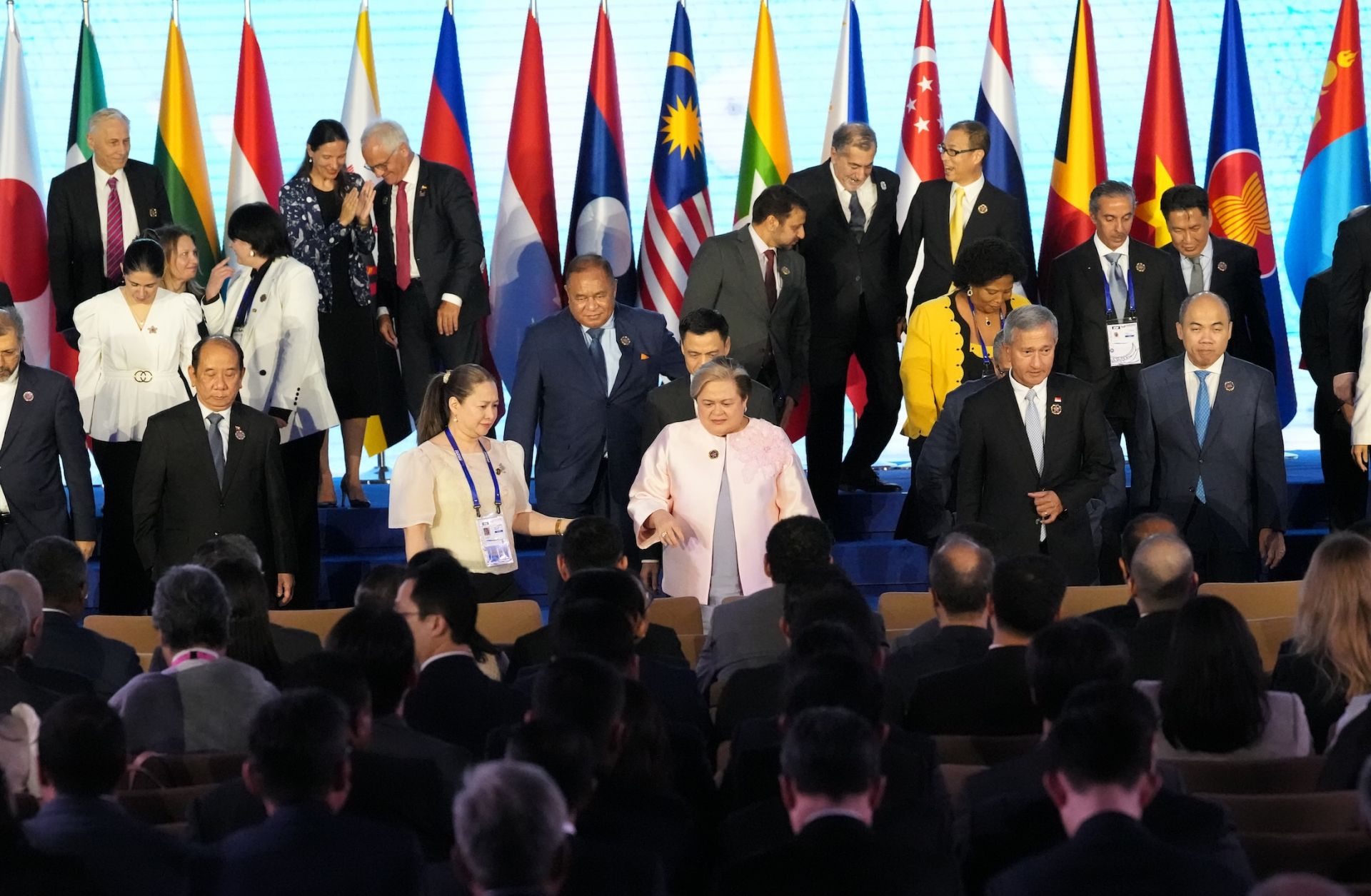 Philippine Foreign Secretary Theresa Lazaro (center) and other leaders leave after a group photo session on the sidelines of the ASEAN Foreign Ministers' Meeting in Manila on July 24, 2026.
