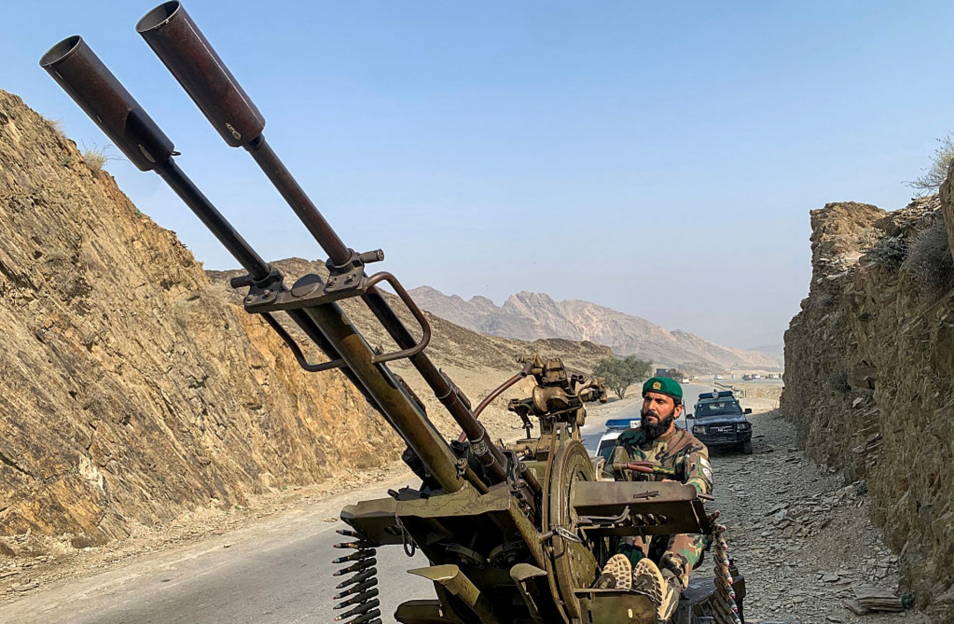 A Taliban security personnel operating an anti-aircraft gun keeps watch for Pakistani airstrikes near the Torkham border crossing between Afghanistan and Pakistan on Feb. 27 in in Nangarhar province, Afghanistan.