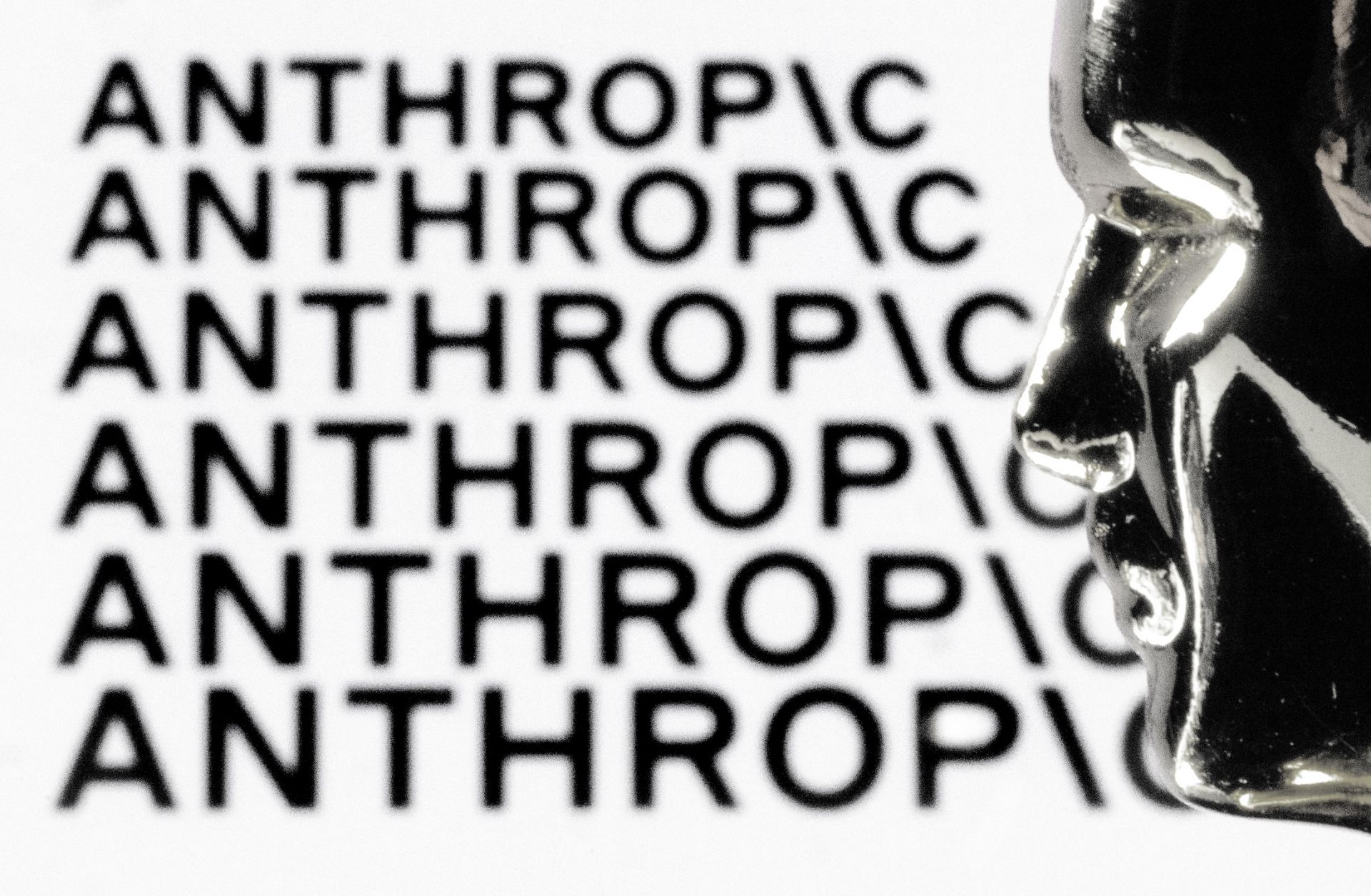 A figurine is seen in front of the logo of the U.S. AI company Anthropic during a photo session in Paris, France, on Feb. 13, 2026.