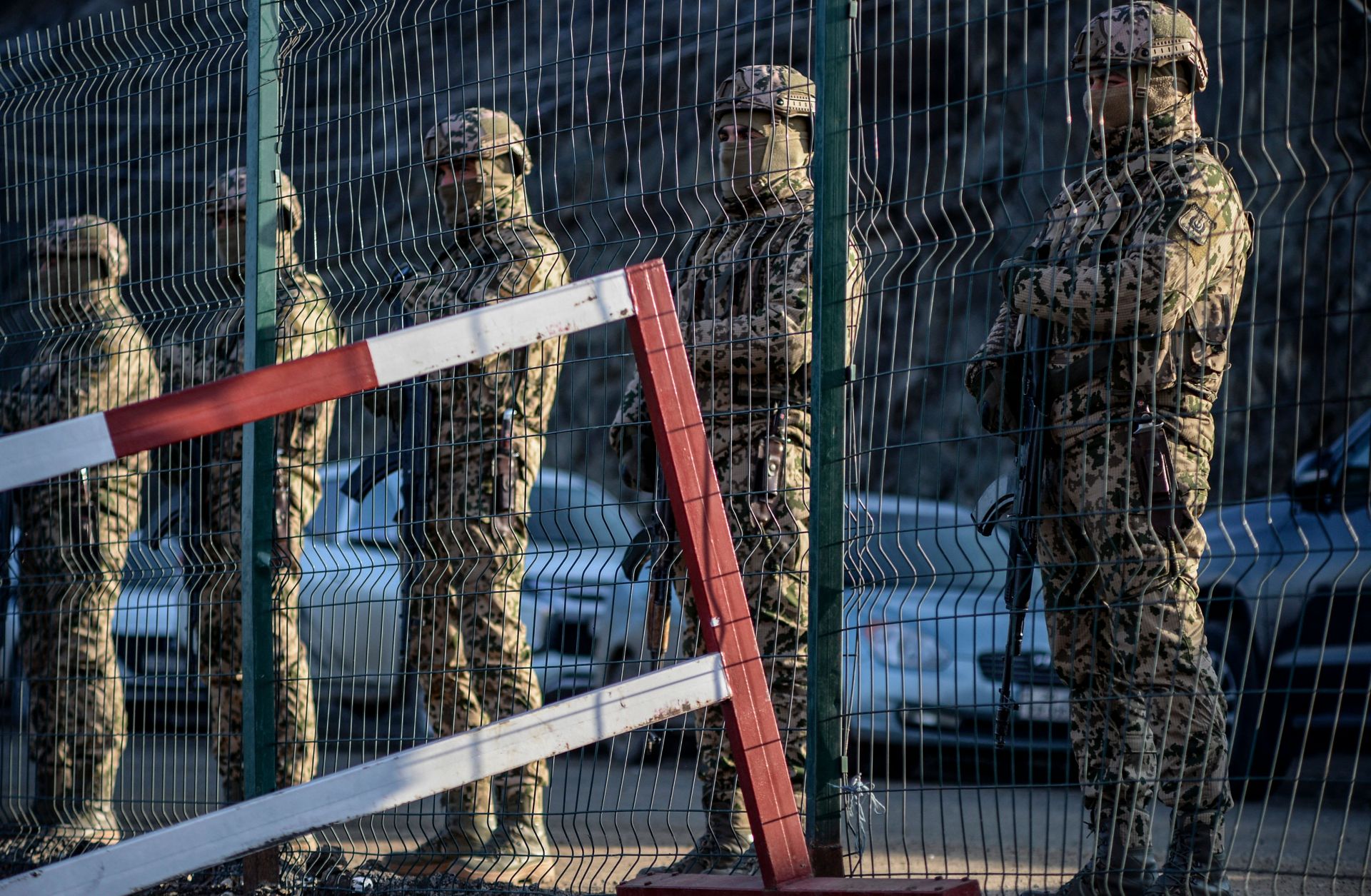 Azeri soldiers stand guard at a checkpoint at the Lachin corridor, the disputed Nagorno-Karabakh region's only land link with Armenia, on Dec. 27, 2022. 