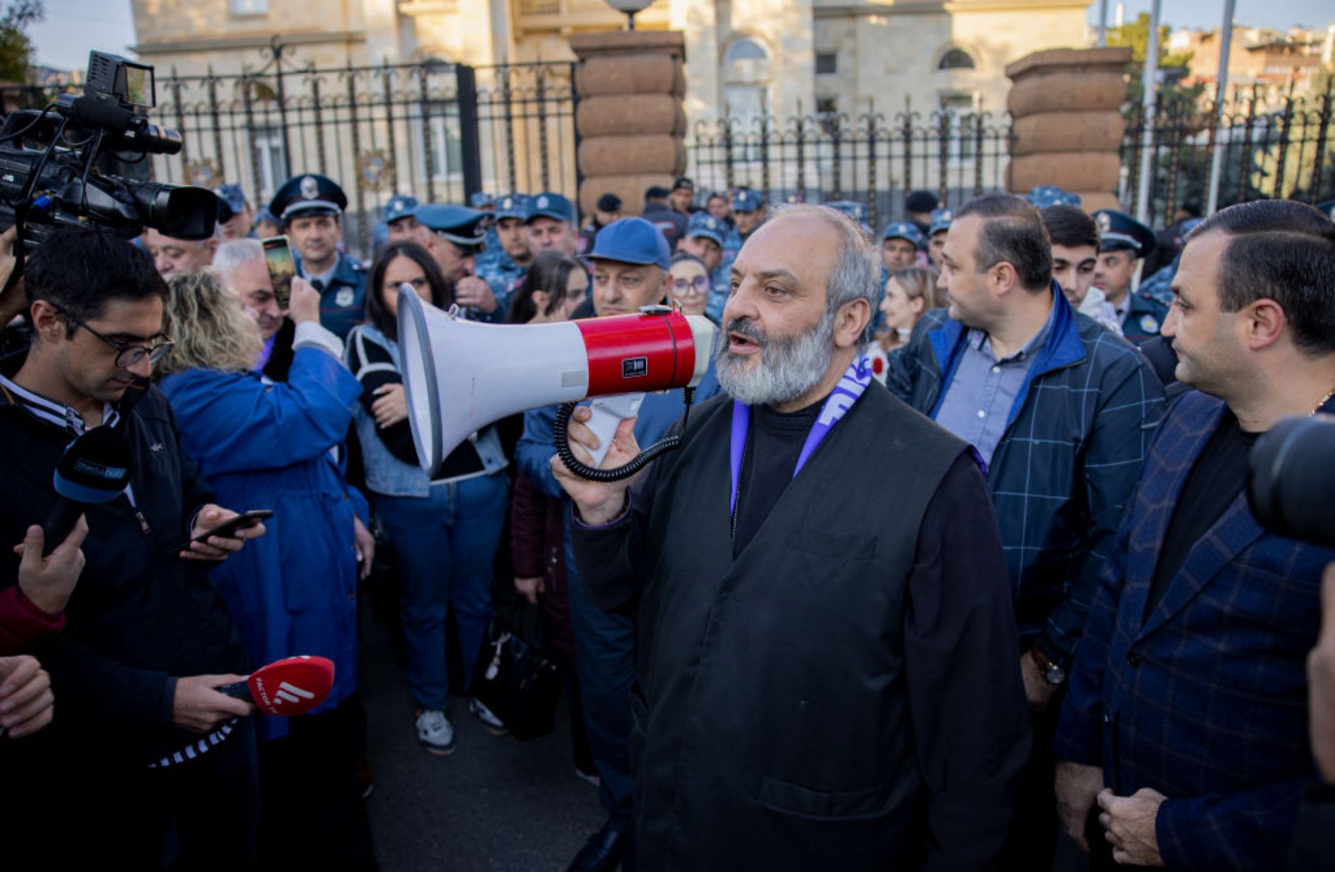 Archbishop Bagrat Galstanyan addresses the crowd with a megaphone during a protest in Yerevan, Armenia, on Oct. 25, 2024. Archbishop Bagrat Galstanyan addresses the crowd with a megaphone during a protest in Yerevan, Armenia, on Oct. 25, 2024.