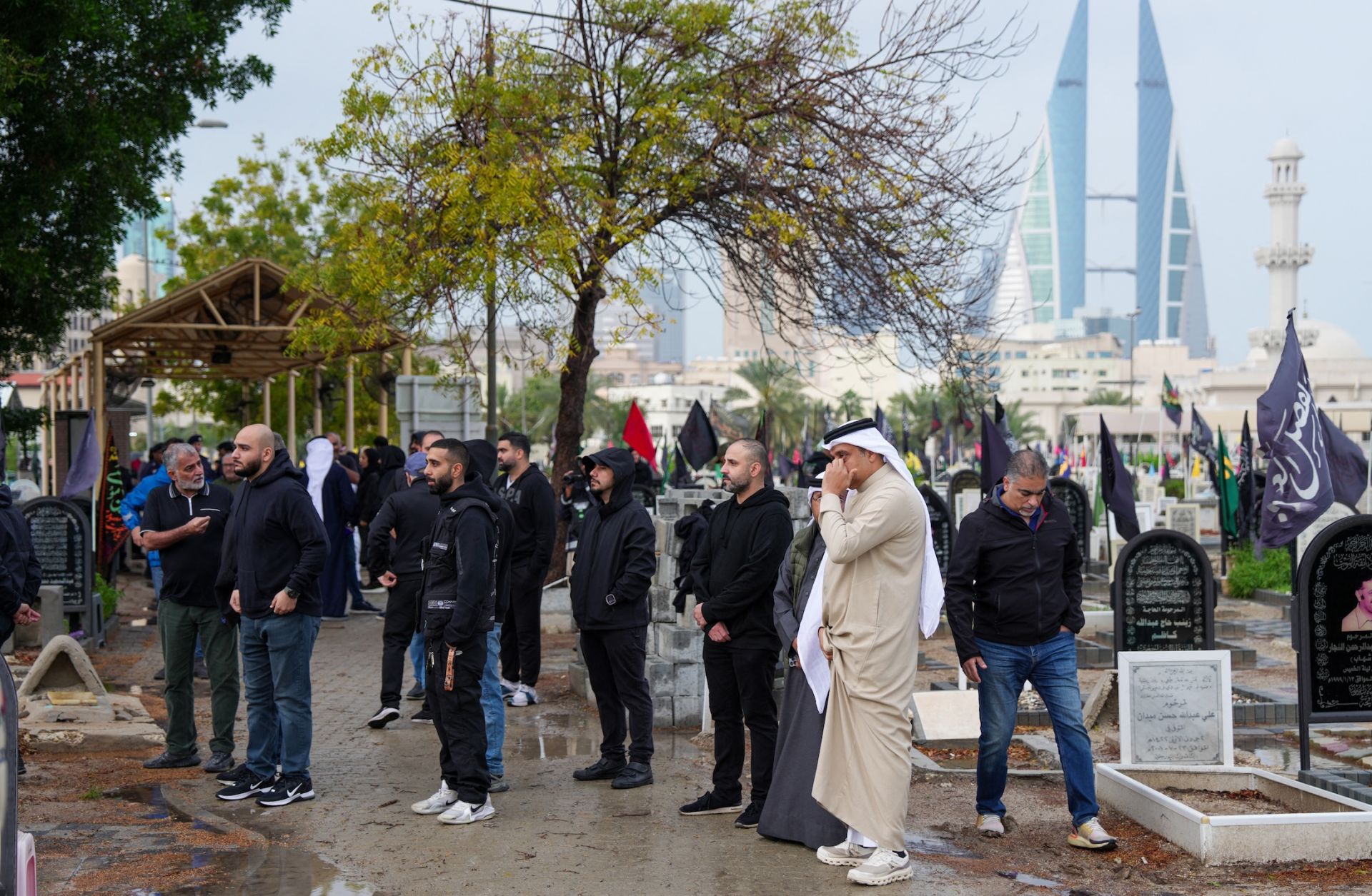 People attend the funeral of a person killed during an Iranian drone attack on a high-rise apartment building in Bahrain's capital, Manama, on March 10, 2026.