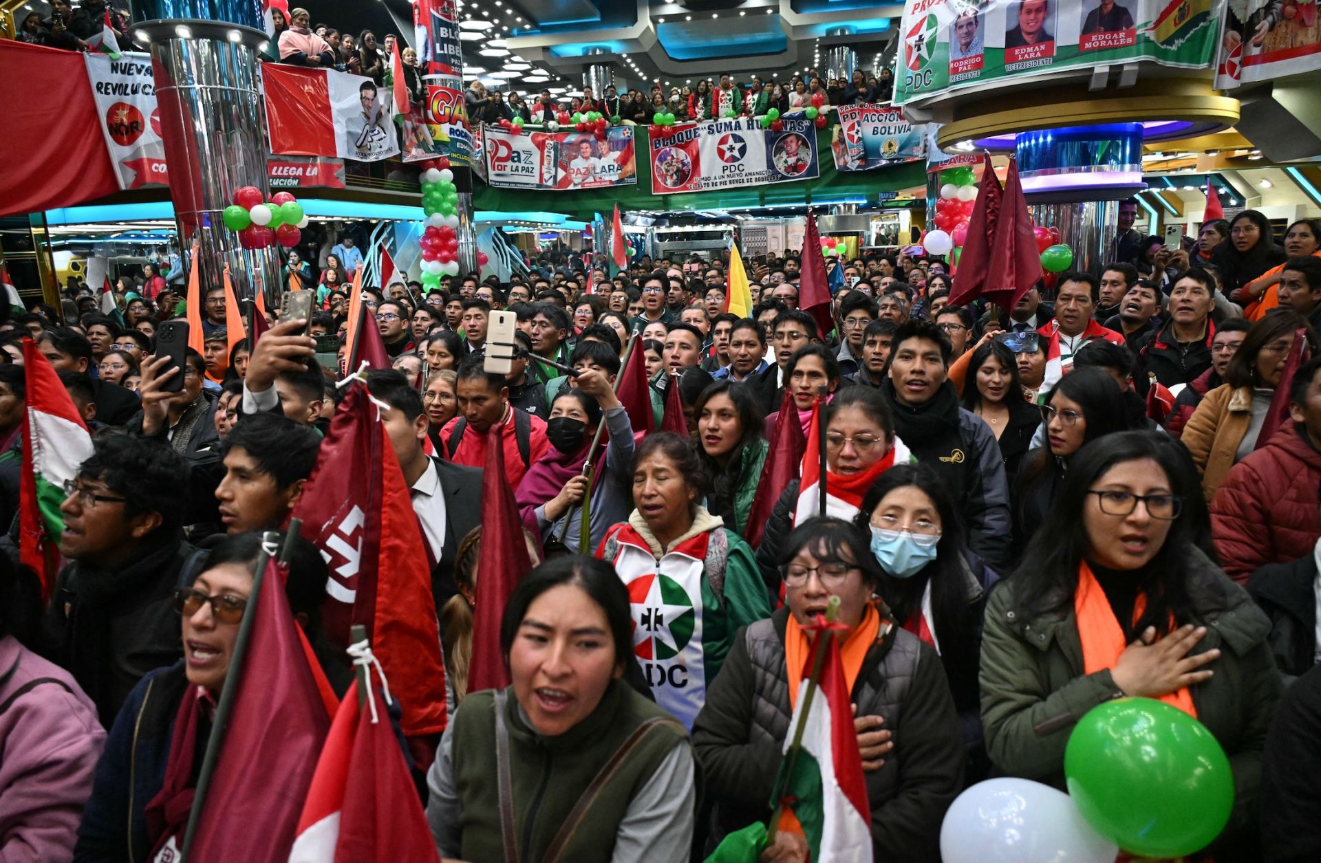 Supporters of Bolivia's presidential candidate for the Christian Democratic Party (PDC), Rodrigo Paz, listen to him speak during a campaign rally in El Alto, Bolivia, on Sept. 30, 2025. 