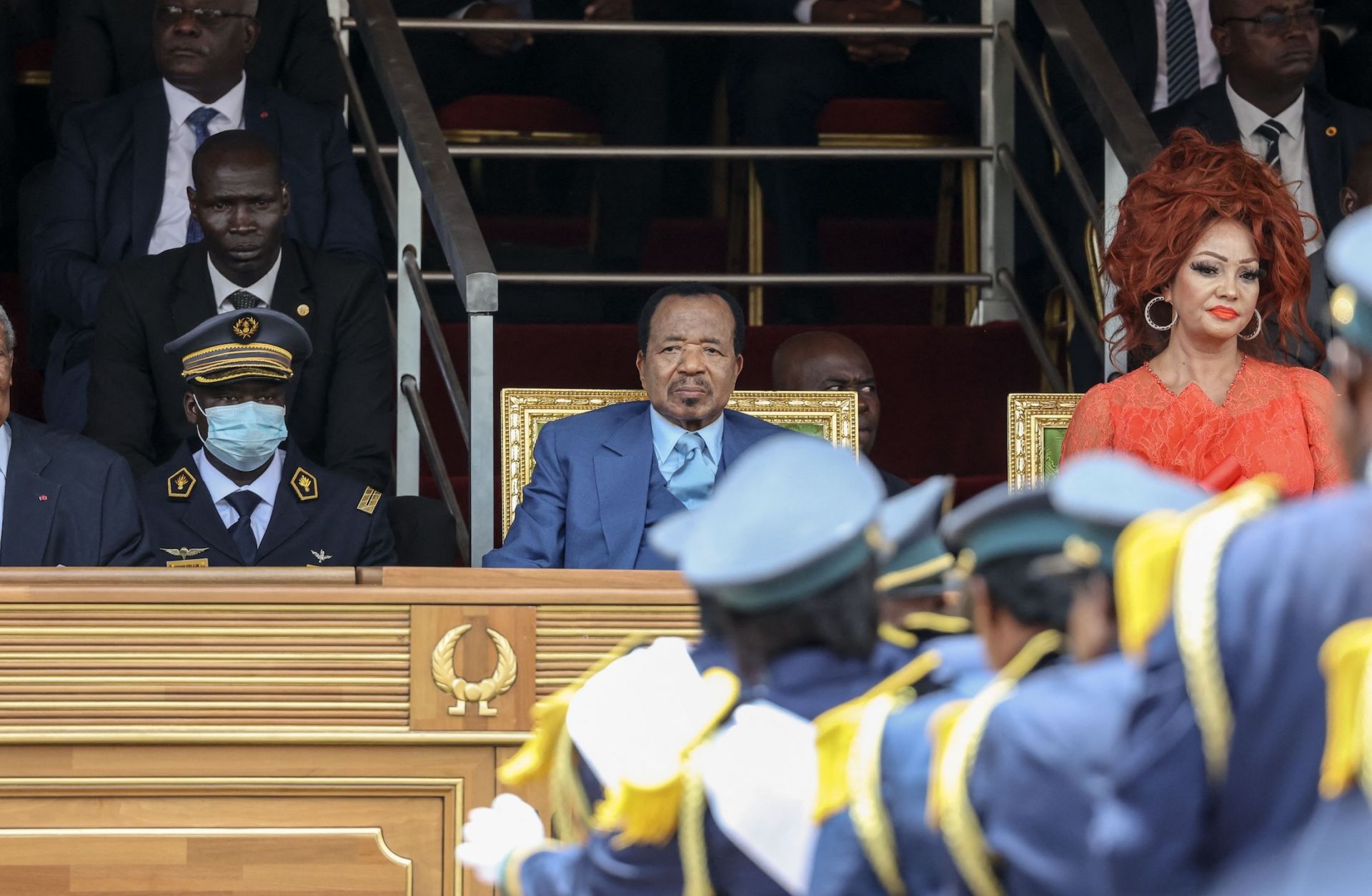 Cameroonian President Paul Biya (left), and his wife Chantal Biya (left) watch a parade marking the 51st celebration of Unity Day in Yaounde on May 20, 2023. 