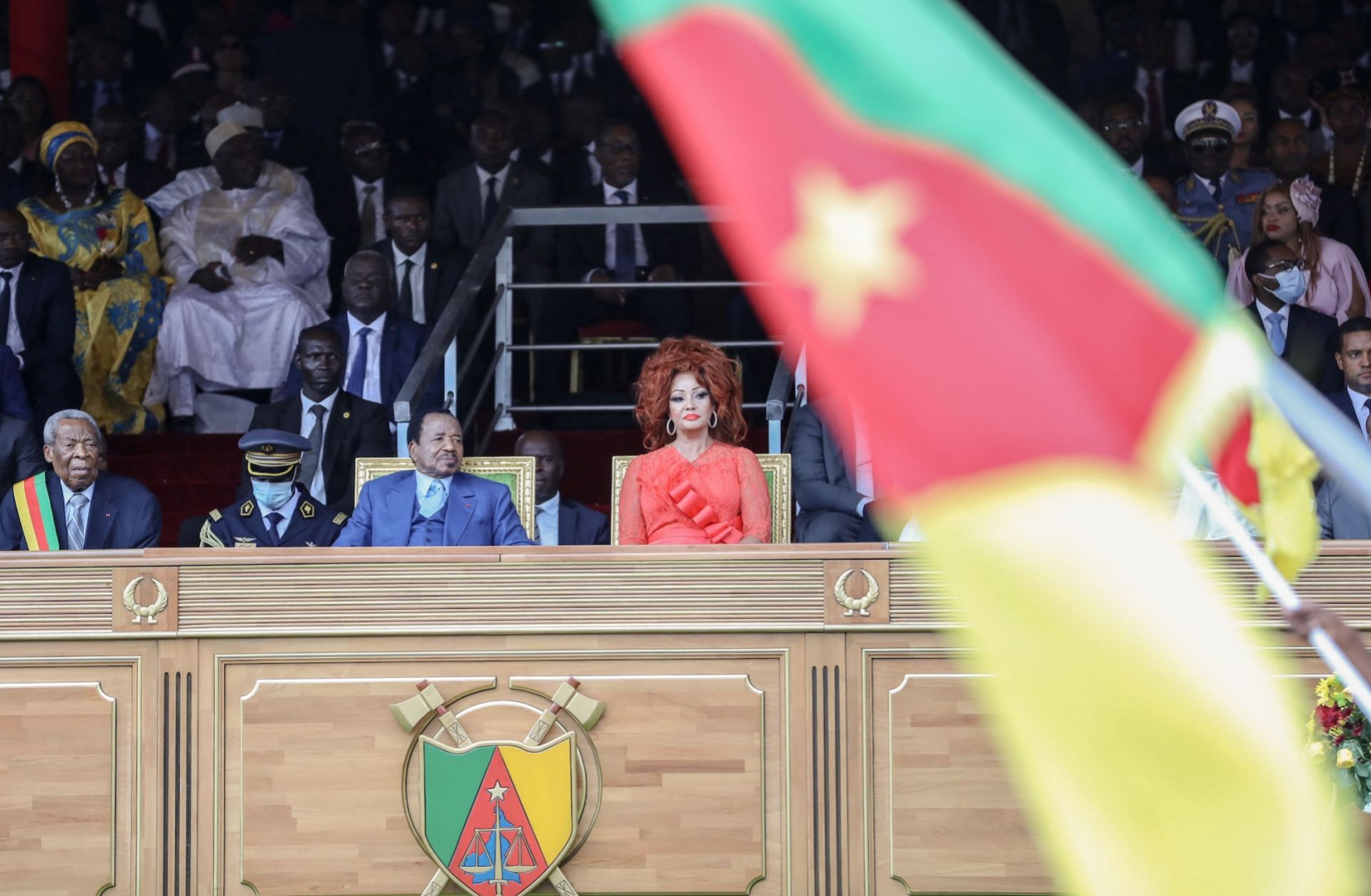 Cameroon President Paul Biya (L) and his wife Chantal Biya react during a parade marking the 51st celebration of Unity Day in Yaounde on May 20, 2023.