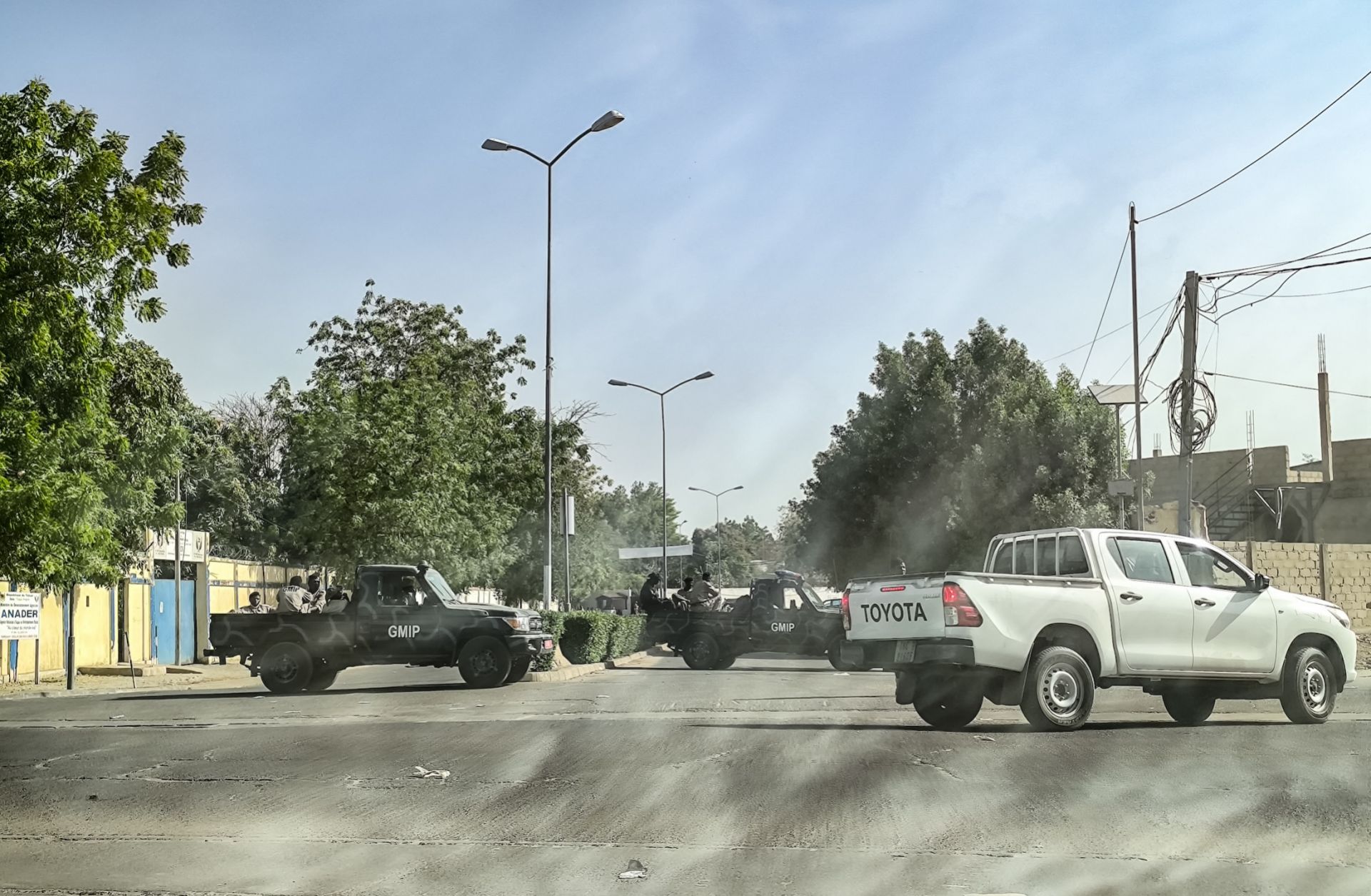 A picture taken through a car window shows Chadian soldiers barring the entrance to the road leading to the headquarters of the opposition Socialist Party Without Borders (PSF) in N'Djamena, Chad, on Feb. 29, 2024. 