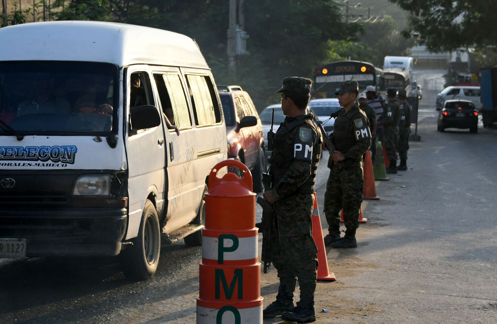 A military police checkpoint in November 2017 in San Pedro Sula, Honduras. The underlying condition that enables the extreme violence of the country's homicide highways is the region's geography.