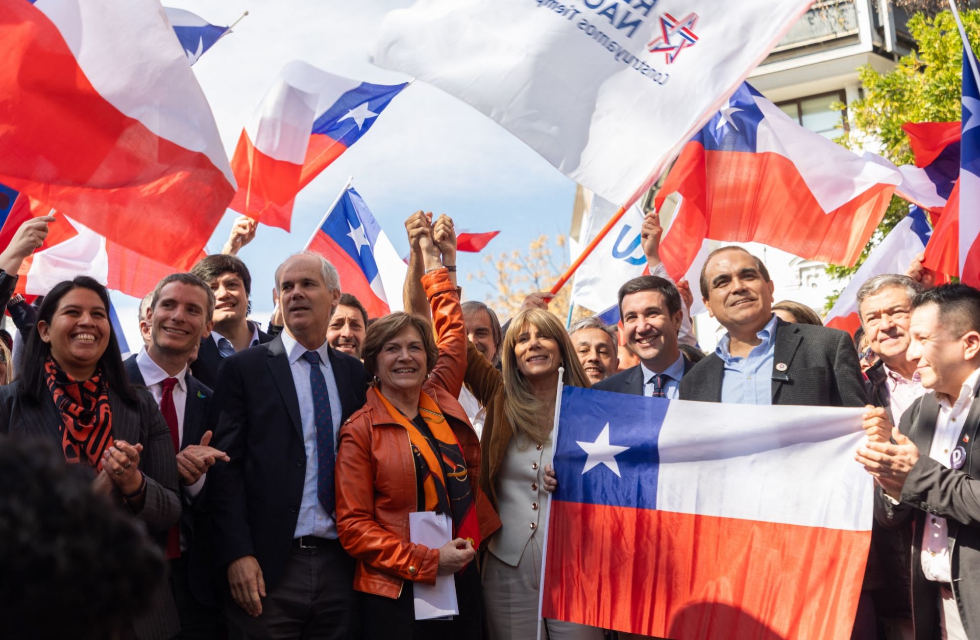 Chile's presidential candidate Evelyn Matthei (C) poses with her team after registering her candidacy at the Electoral Service of Chile in Santiago on Aug. 16, 2025.