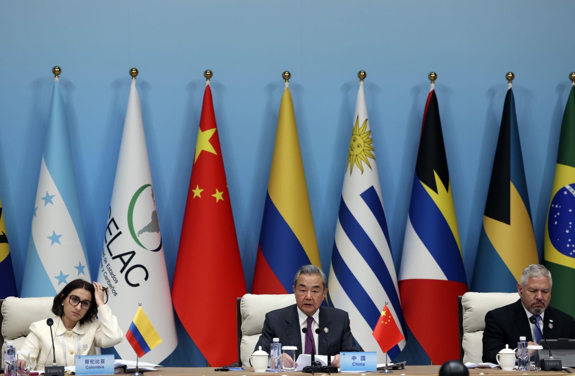 (L-R) Colombian Foreign Minister Laura Sarabia, Chinese Foreign Minister Wang Yi and Honduran Foreign Minister Eduardo Enrique Reina attend a plenary session of the China-CELAC ministerial meeting at the Great Hall of the People on May 13, 2025, in Beijing, China. (L-R) Colombian Foreign Minister Laura Sarabia, Chinese Foreign Minister Wang Yi and Honduran Foreign Minister Eduardo Enrique Reina attend a plenary session of the China-CELAC ministerial meeting at the Great Hall of the People on May 13, 2025, in Beijing, China.