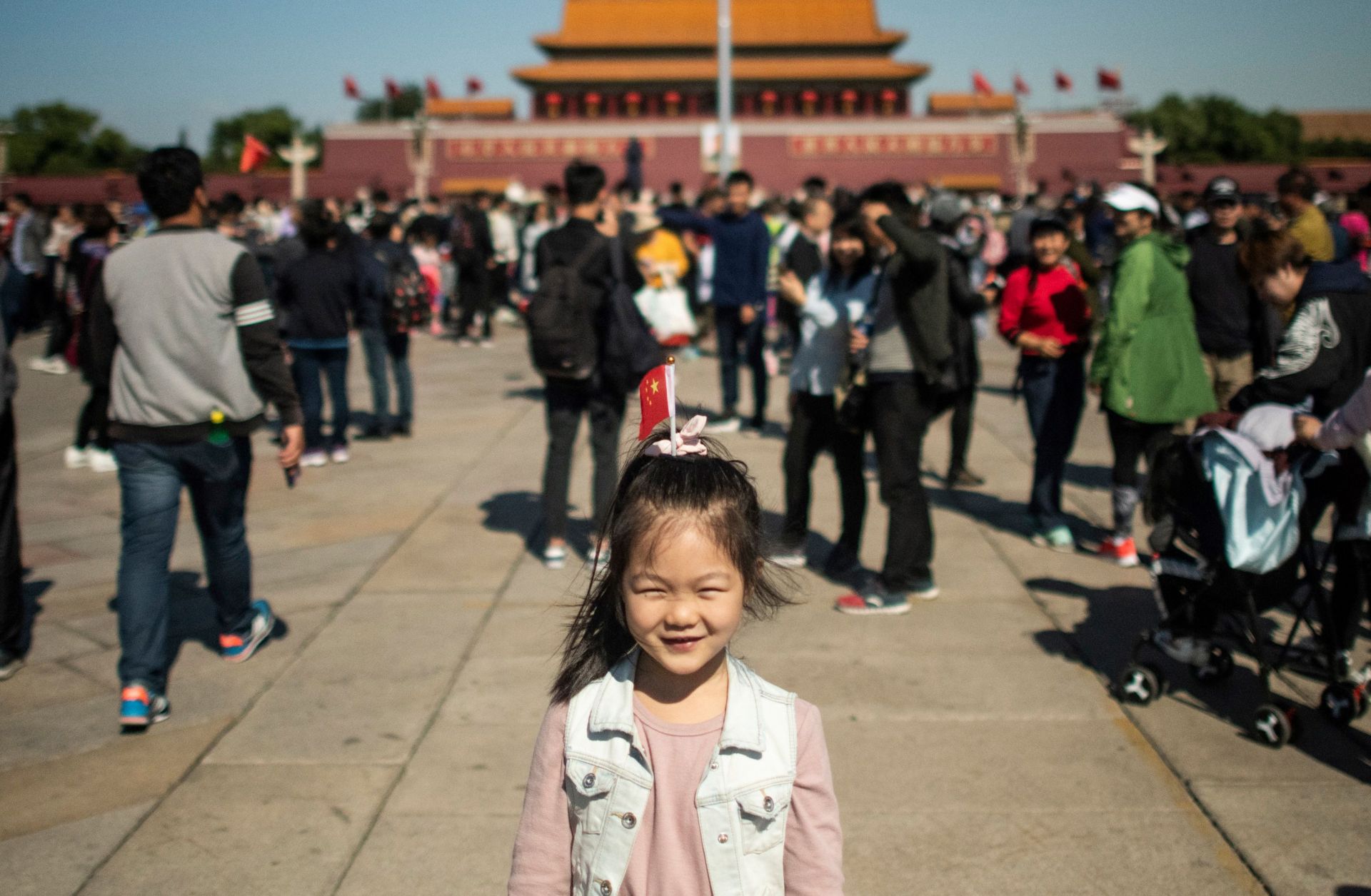 A girl stands in Tiananmen Square during National Day in Beijing, China, on Oct. 1, 2018. 
