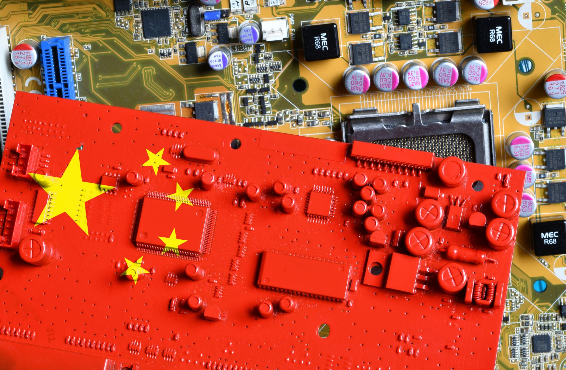 Flag of China on a red-painted printed circuit board.
