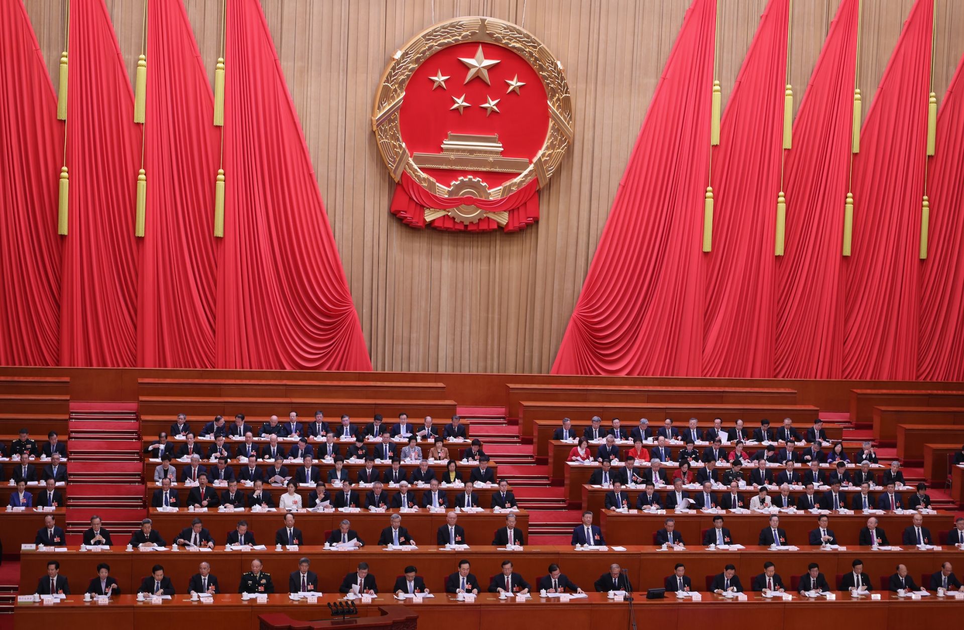 Chinese President Xi Jinping (center) and Premier Li Qiang attend a plenary session of China's National People's Congress (NPC) at the Great Hall of the People on March 9, 2026, in Beijing, China.