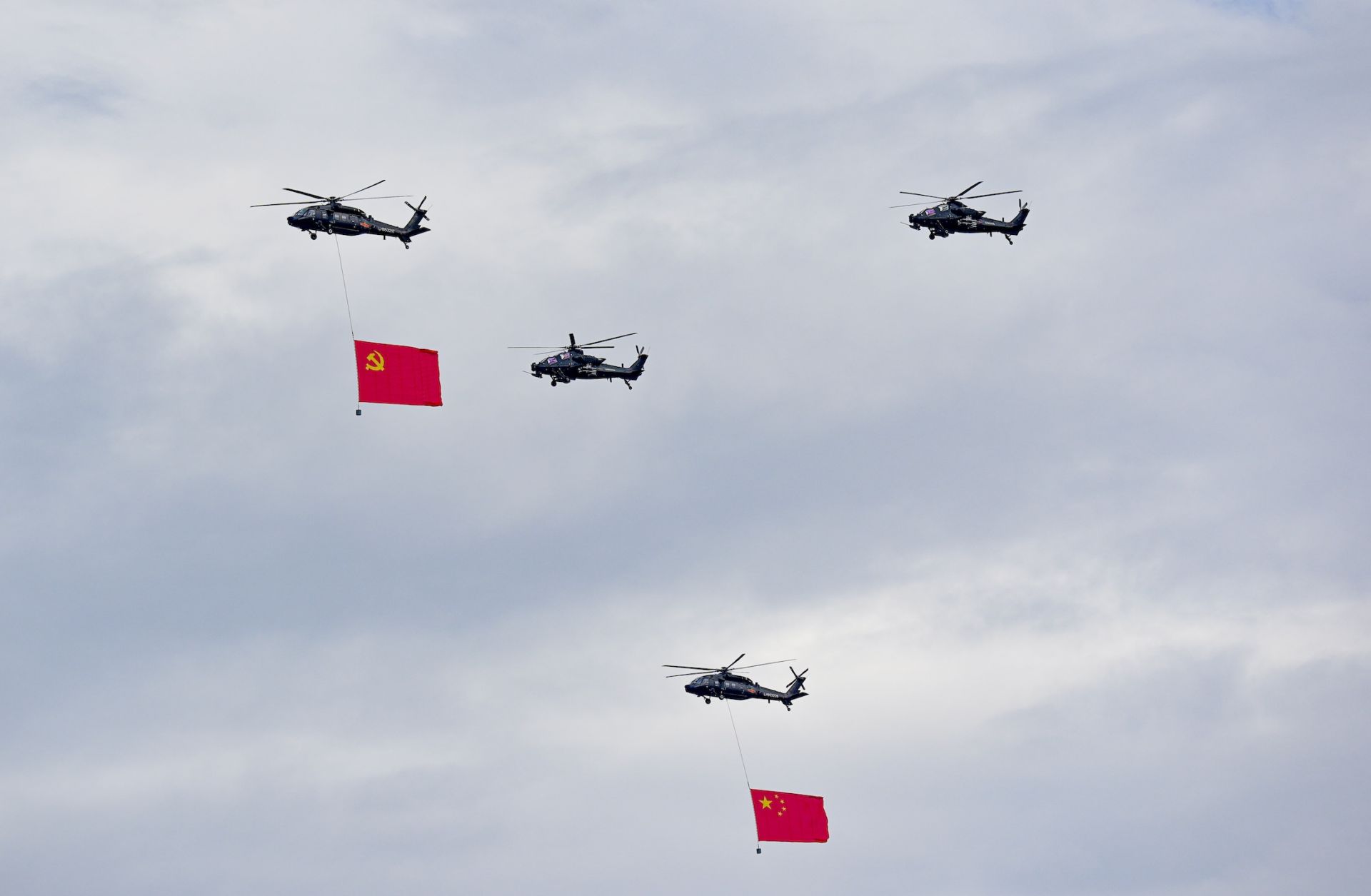 Helicopters fly in the sky during a rehearsal for a military parade Aug. 24 in Beijing.