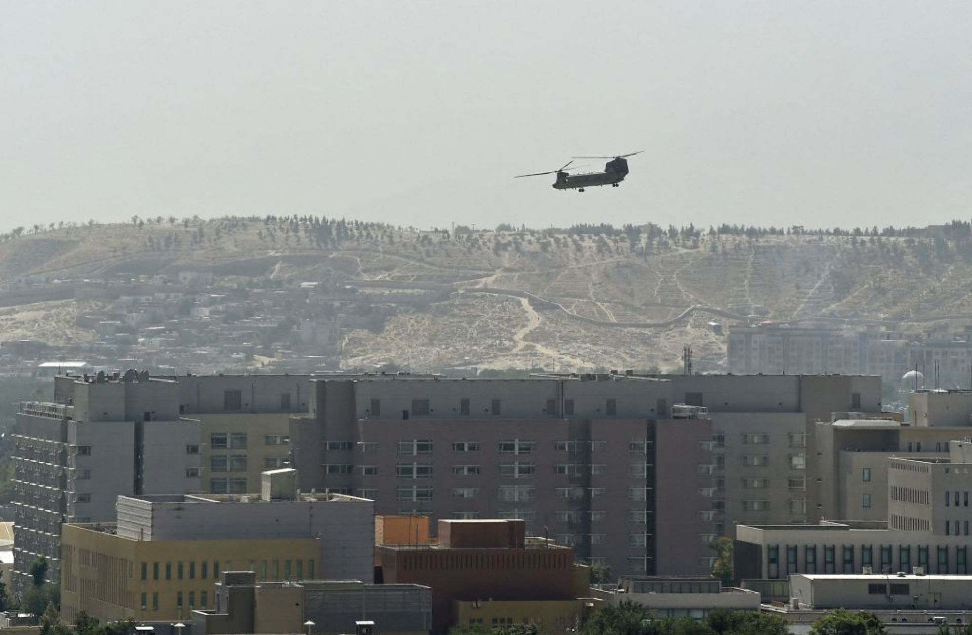 A U.S. military helicopter Aug. 15, 2021, above the U.S. Embassy in Kabul, Afghanistan.