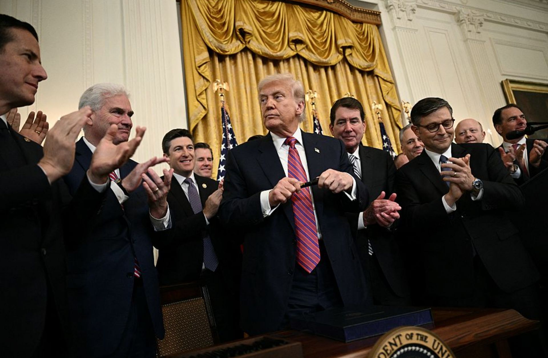 U.S. President Donald Trump prepares to sign the GENIUS Act in the East Room of the White House in Washington, DC, on July 18, 2025. 