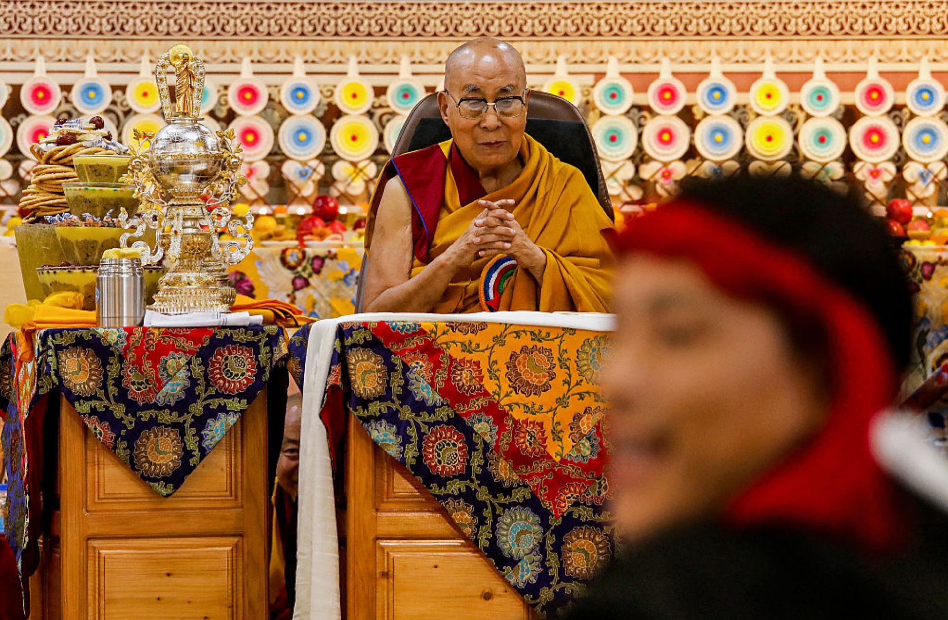 Tibetan spiritual leader the Dalai Lama looks on as offerings presented by Buddhist followers are laid on a table during a Long Life Prayer offering ceremony at the Main Tibetan Temple in McLeod Ganj, near the Indian city of Dharamshala, on June 30, 2025. Tibetan spiritual leader the Dalai Lama looks on as offerings presented by Buddhist followers are laid on a table during a Long Life Prayer offering ceremony at the Main Tibetan Temple in McLeod Ganj, near the Indian city of Dharamshala, on June 30, 2025.