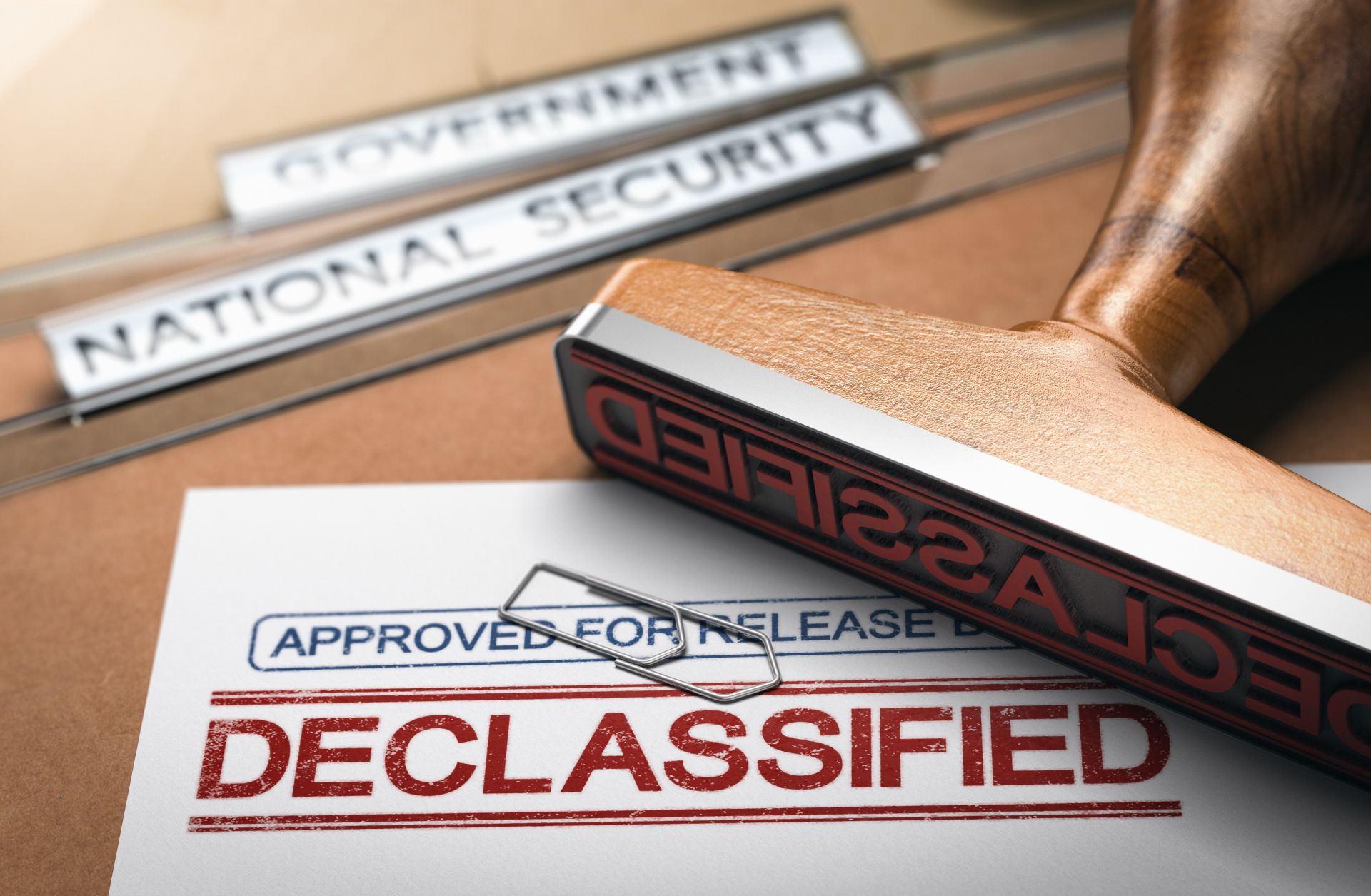 3D illustration of two folders and a rubber stamp with the word "declassified" printed on a document.