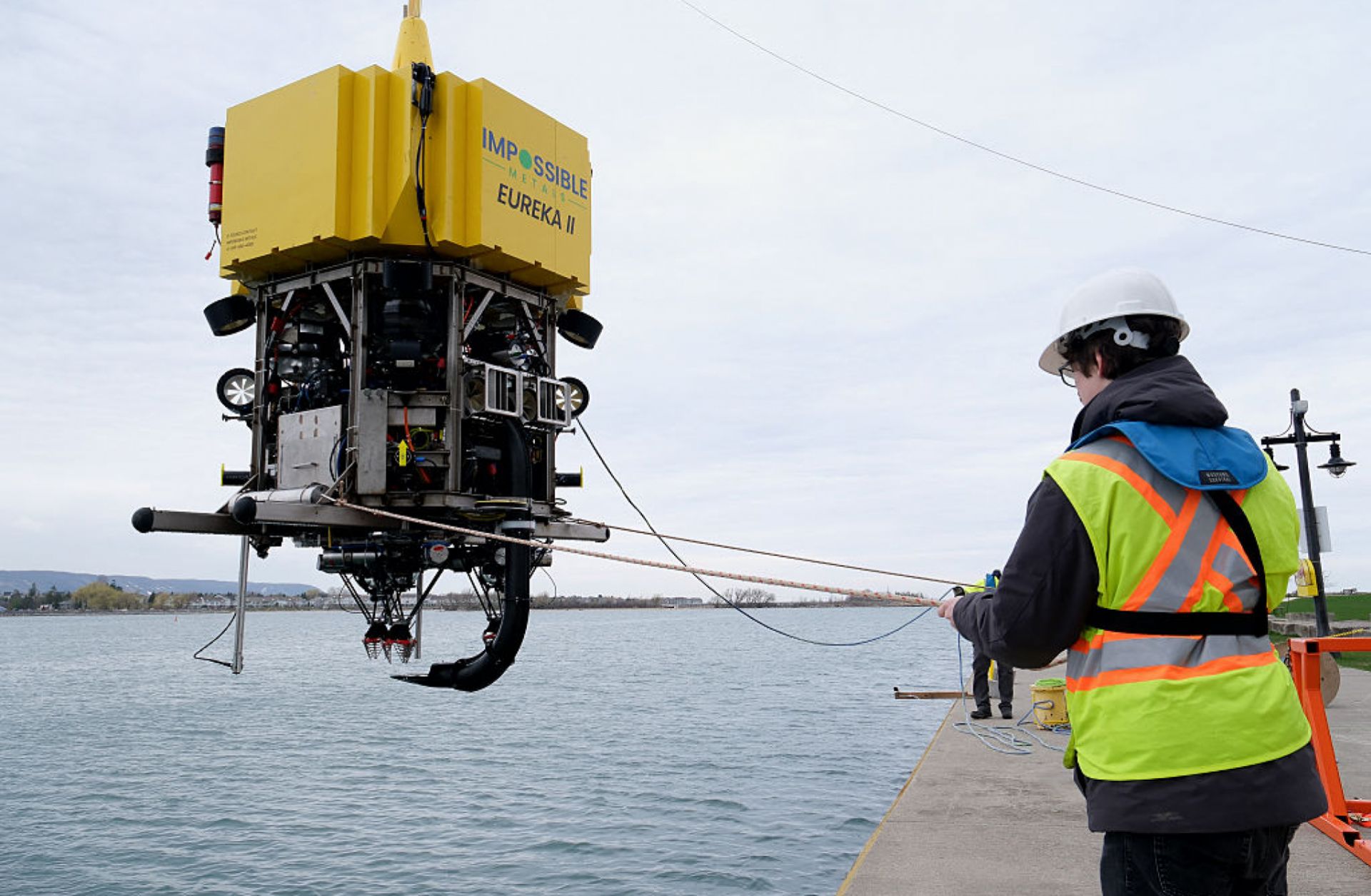 A worker positions a robotic underwater vehicle that can be remotely operated to harvest mineral deposits in the deep ocean, after conducting tests in a lake in Collingwood, Ontario, on May 1, 2025.