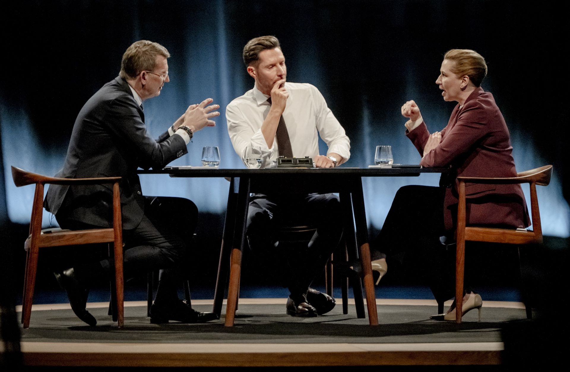 Danish Defense Minister and top candidate of Denmark's Venstre party, Troels Lund Poulsen (left), and Danish Prime Minister and top candidate of the Social Democrat Party, Mette Frederiksen (right), attend a debate in Copenhagen on March 15, 2026.