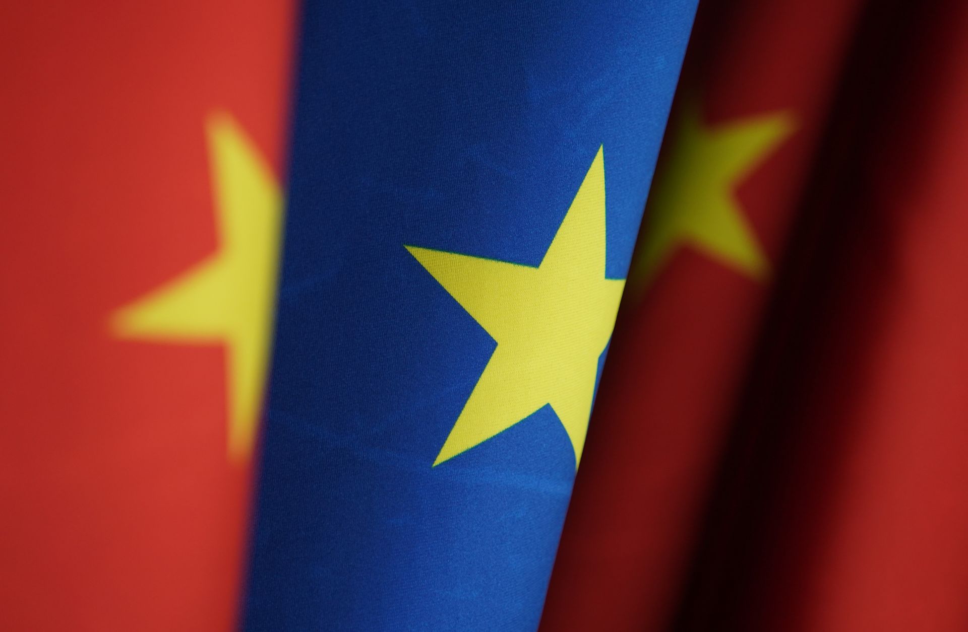 Chinese and EU flags stand at the chancellery on Jan. 26, 2021, in Berlin, Germany. The two entities recently reached a comprehensive agreement on investment. 