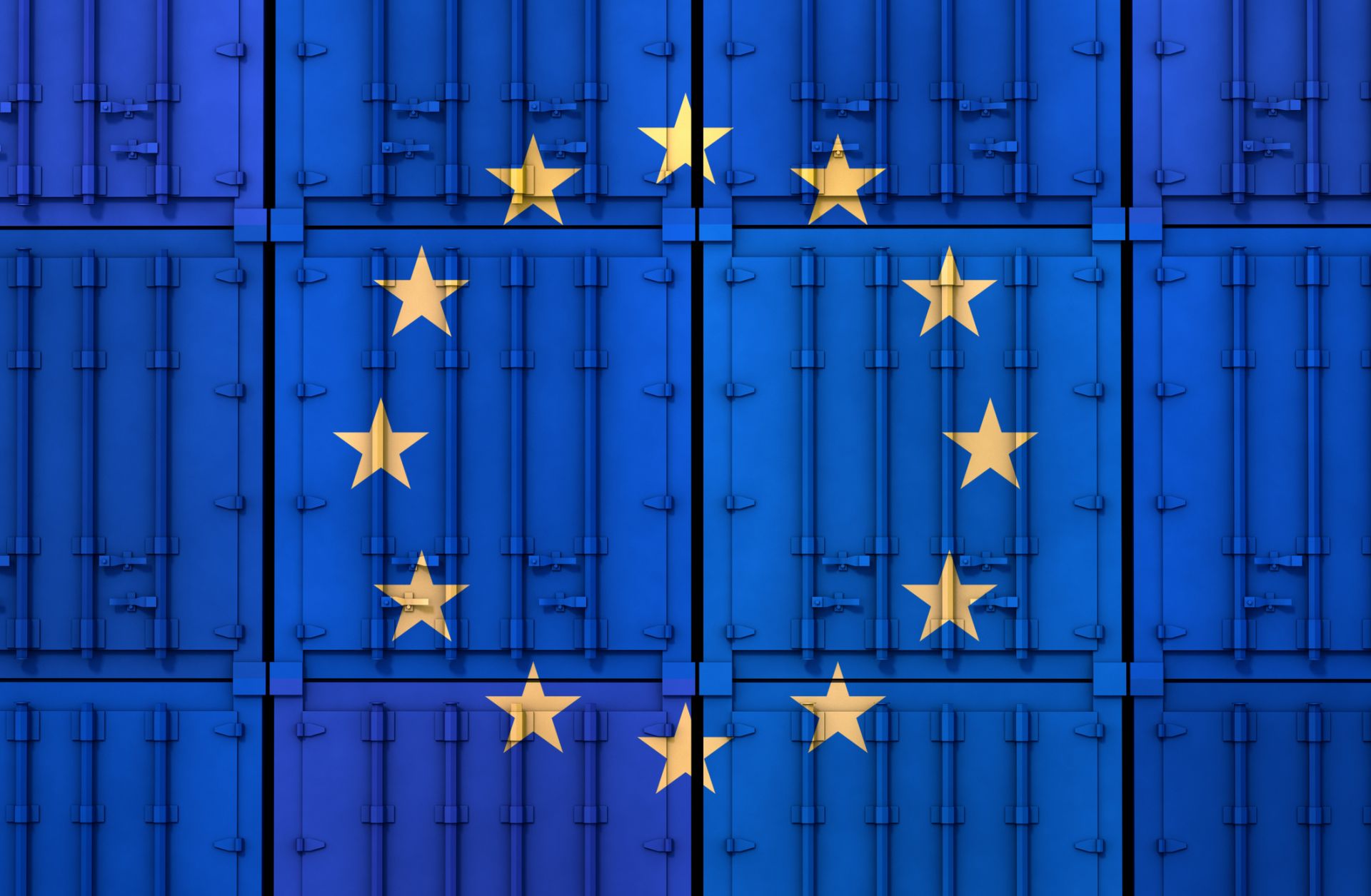 The EU flag is seen on stacked cargo containers.