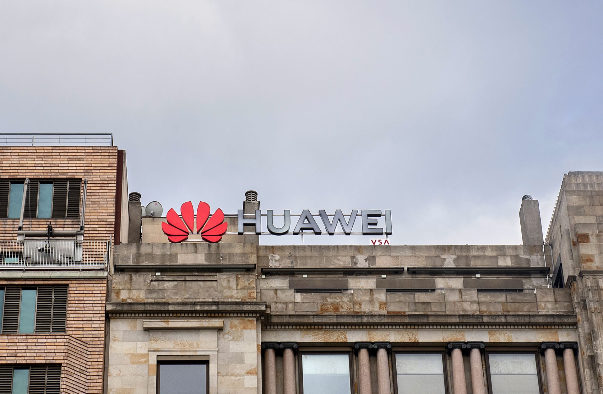 A Huawei logo looms over a street in Barcelona, Spain.