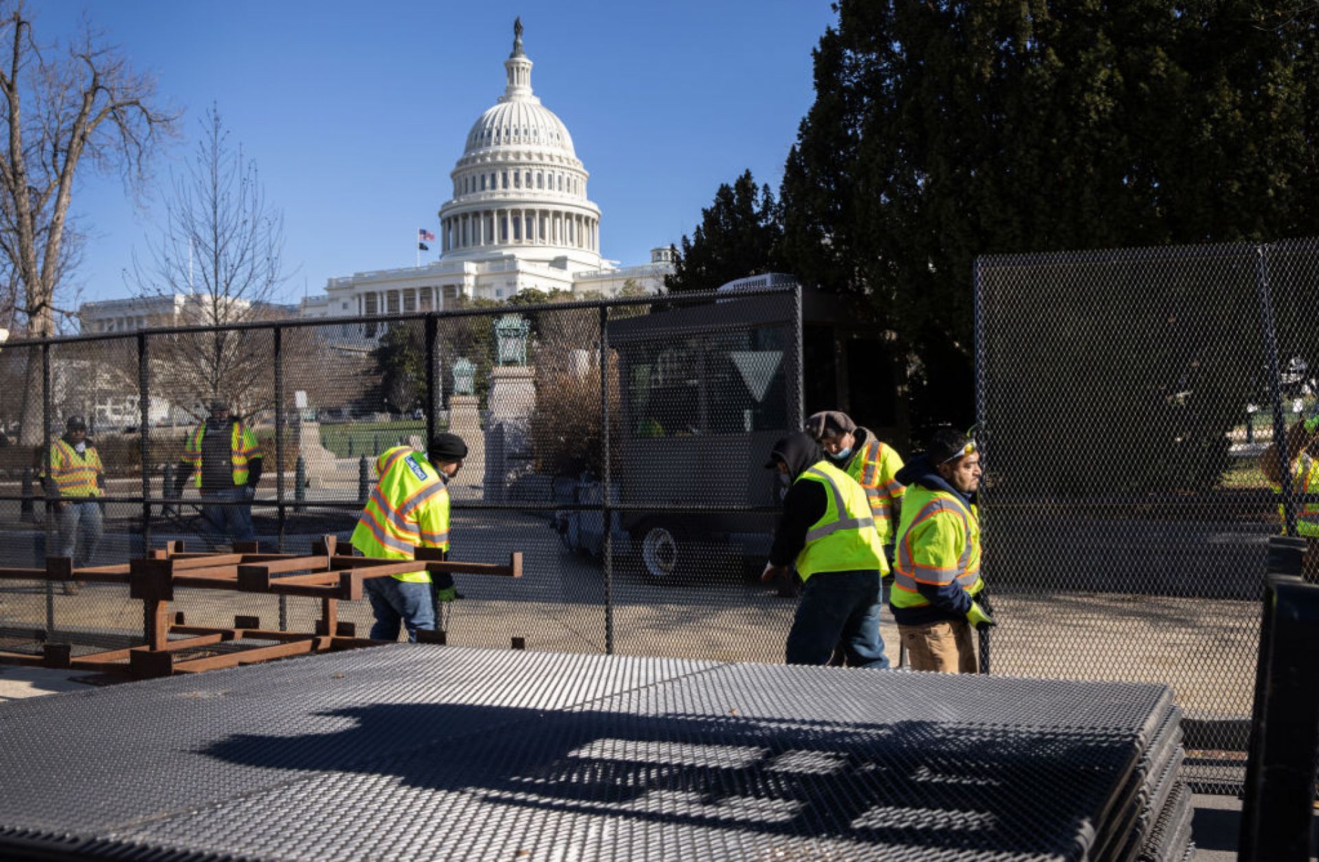 Workers build a fence around the U.S. Capitol on Jan. 7, 2021, in Washington, the day after supporters of U.S. President Donald Trump stormed the building.
