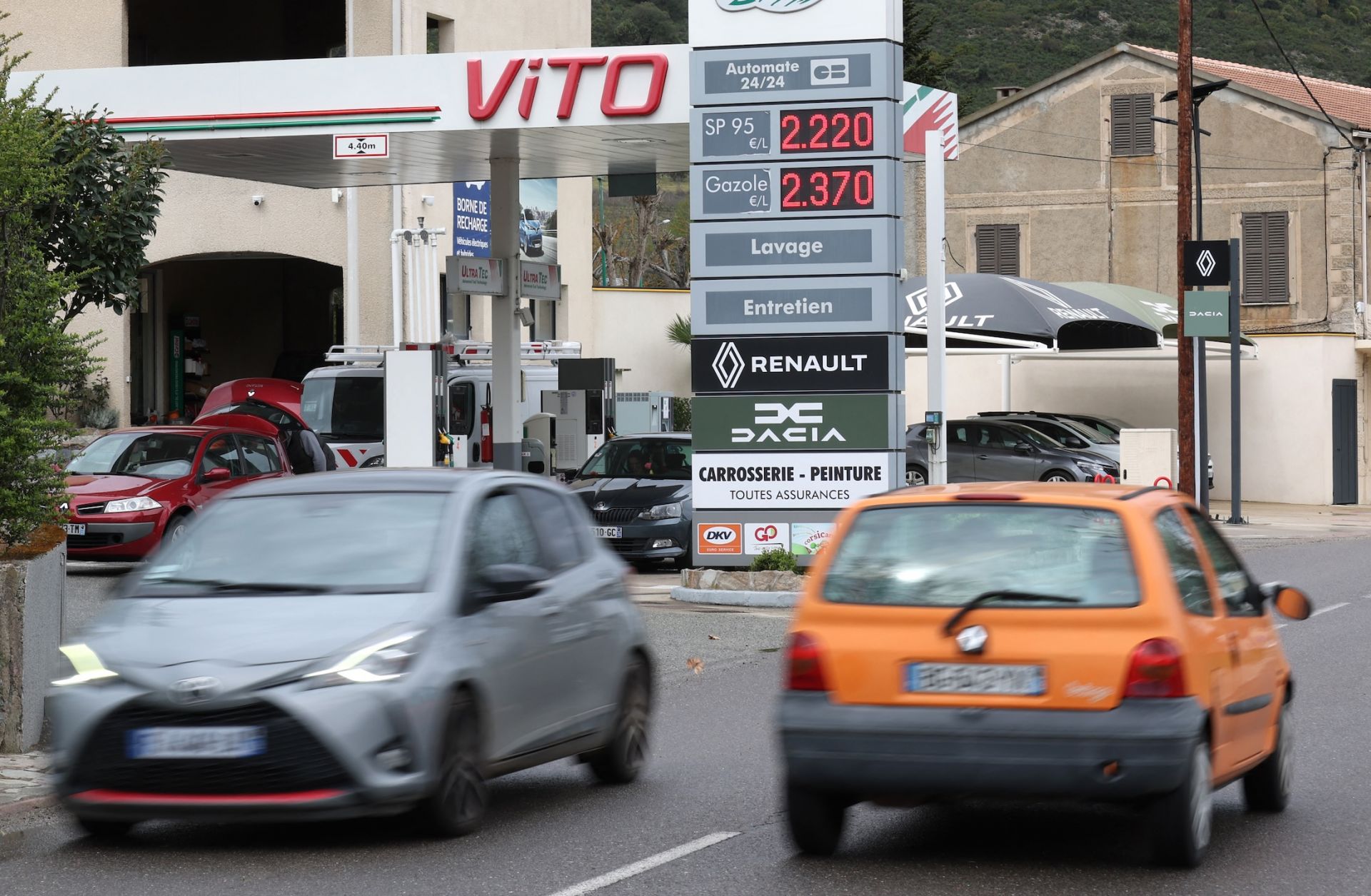 Cars drive past a gas station in Ponte Leccia on the French Mediterranean island of Corsica on March 26, 2026. 