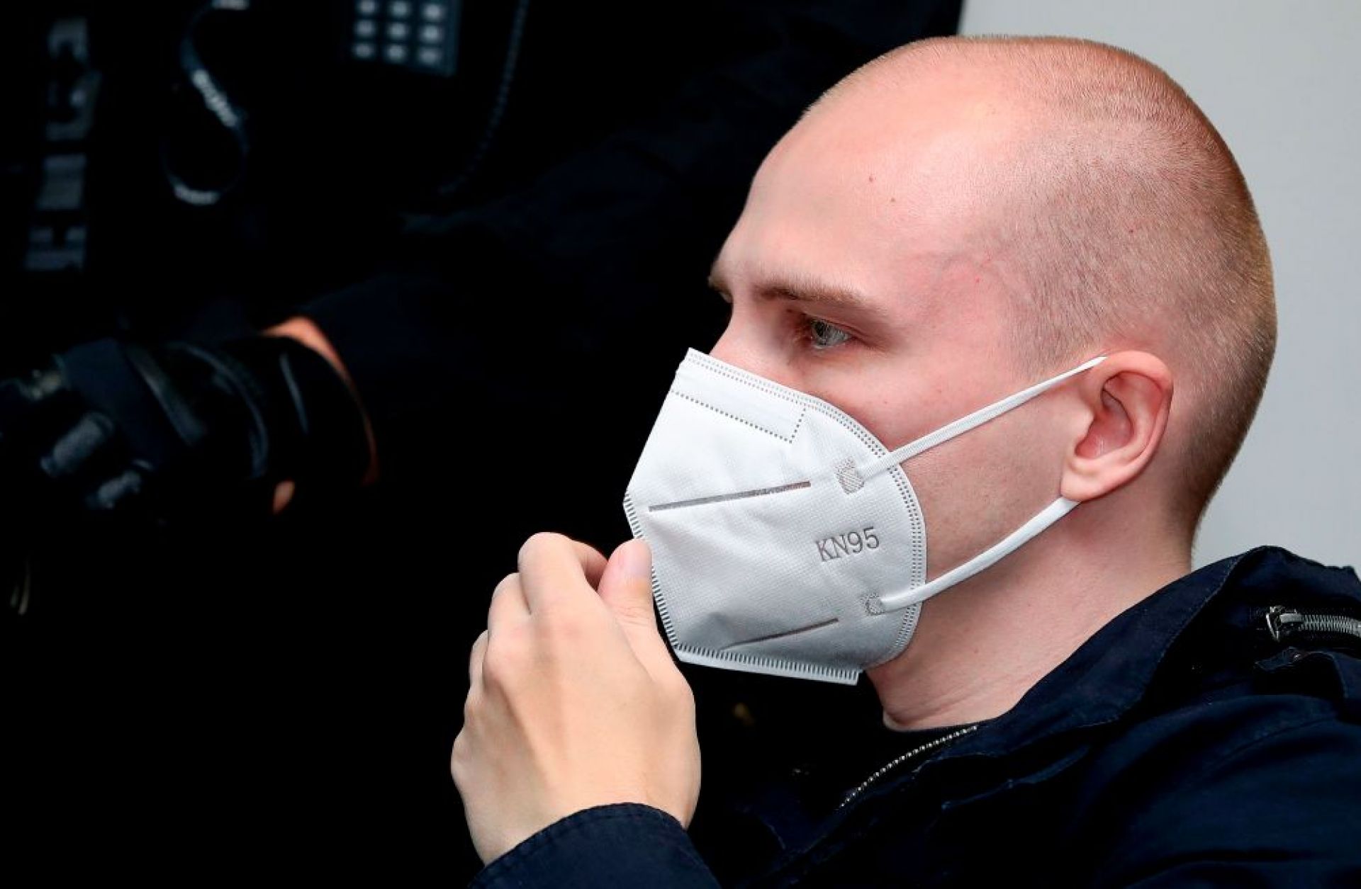 Stephan Balliet, who is accused of shooting two people dead after an attempt to storm a synagogue in Halle an der Saale, eastern Germany, wears a face mask as he waits for the start of the 18th day of his trial on Nov. 3, 2020, at the district court in Magdeburg, eastern Germany.