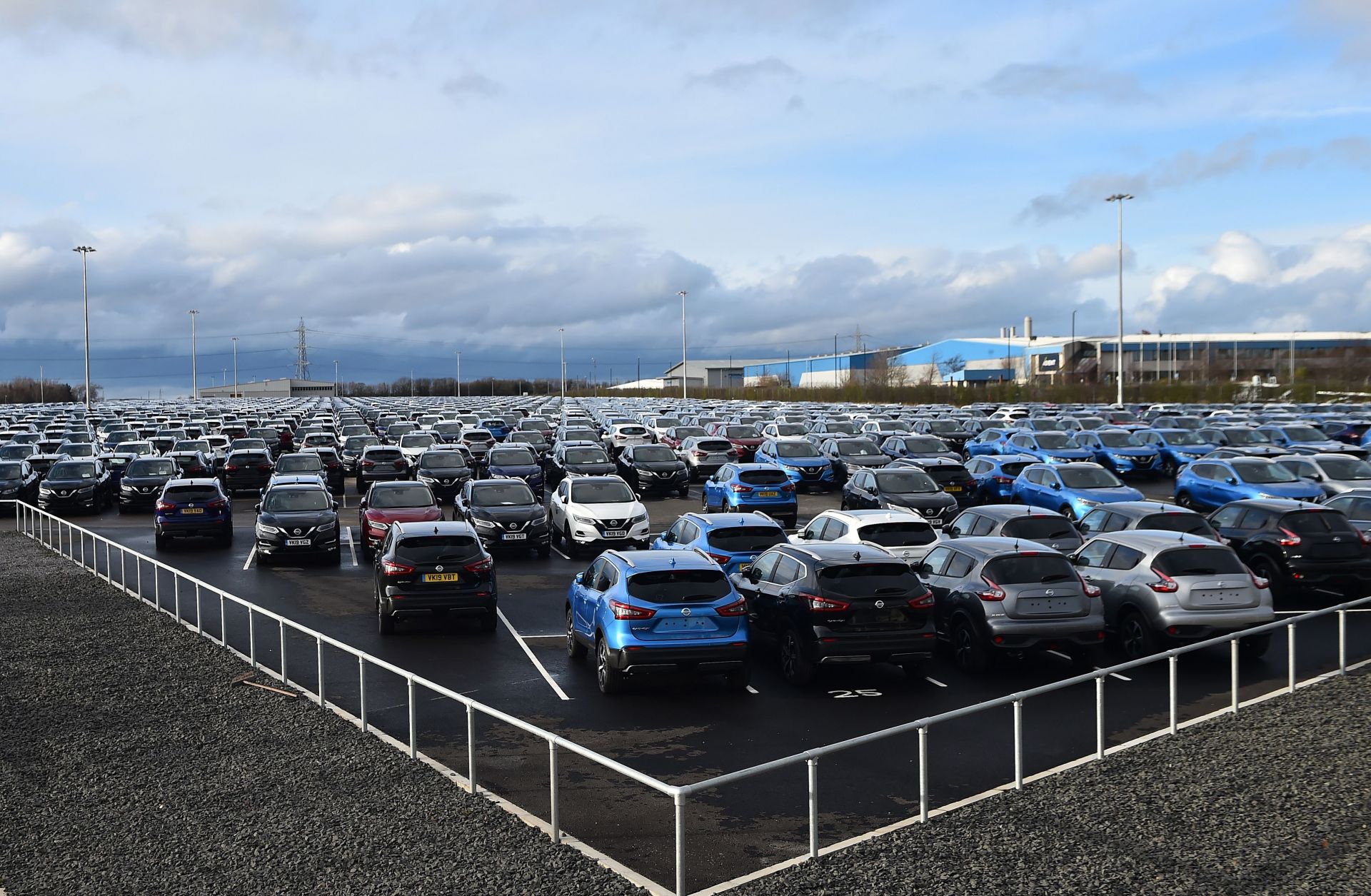 Nissan cars are pictured, parked in a lot at its' Sunderland plant in north east England on March 16, 2019. 