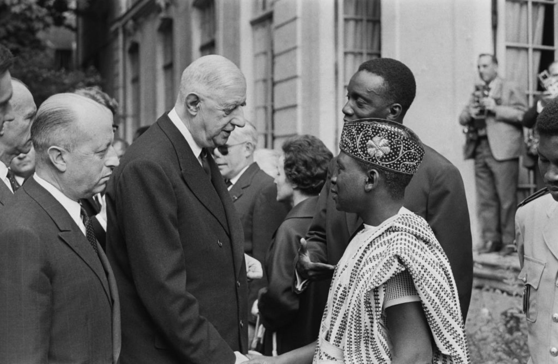 A picture released on July 12, 1963, of then-French President Gen. Charles de Gaulle (2L) and Jacques Foccart (L) greeting African, Malagasy and French overseas territories veterans arriving in Paris for French Bastille Day celebrations. A picture released on July 12, 1963, of then-French President Gen. Charles de Gaulle (2L) and Jacques Foccart (L) greeting African, Malagasy and French overseas territories veterans arriving in Paris for French Bastille Day celebrations.