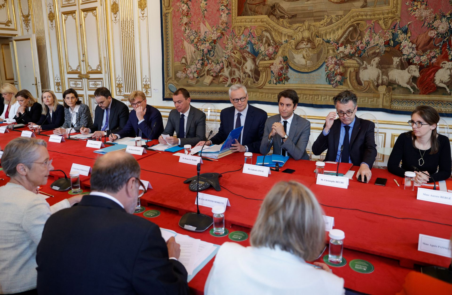 French Prime Minister Elisabeth Borne (front, left) meets with members of the government's newly reshuffled cabinet at a hotel in Paris, France, on July 24, 2023. 