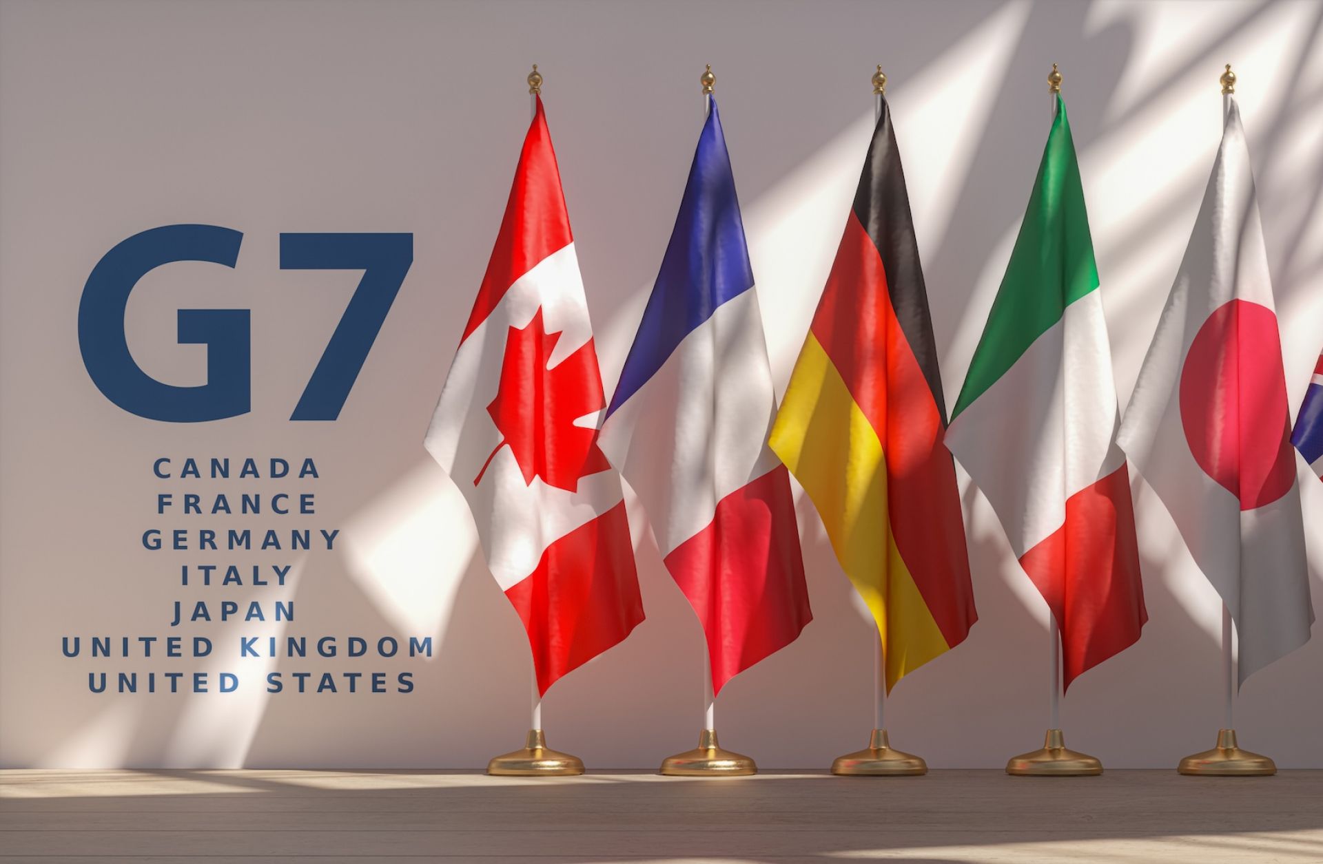 An image shows a row of flags from the G7 members. 