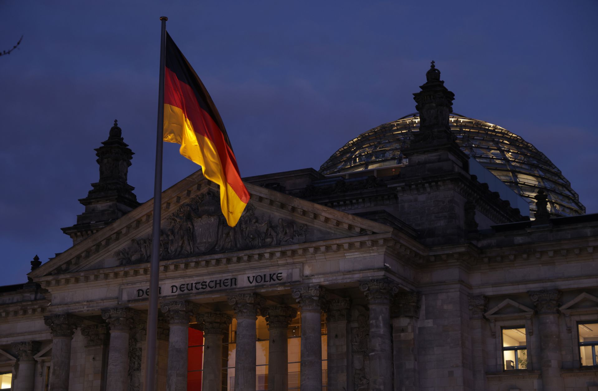 The seat of Germany's lower house of parliament stands at dusk on the day police conducted nationwide raids against a suspected insurrectionist group on Dec. 7, 2022, in Berlin, Germany. 