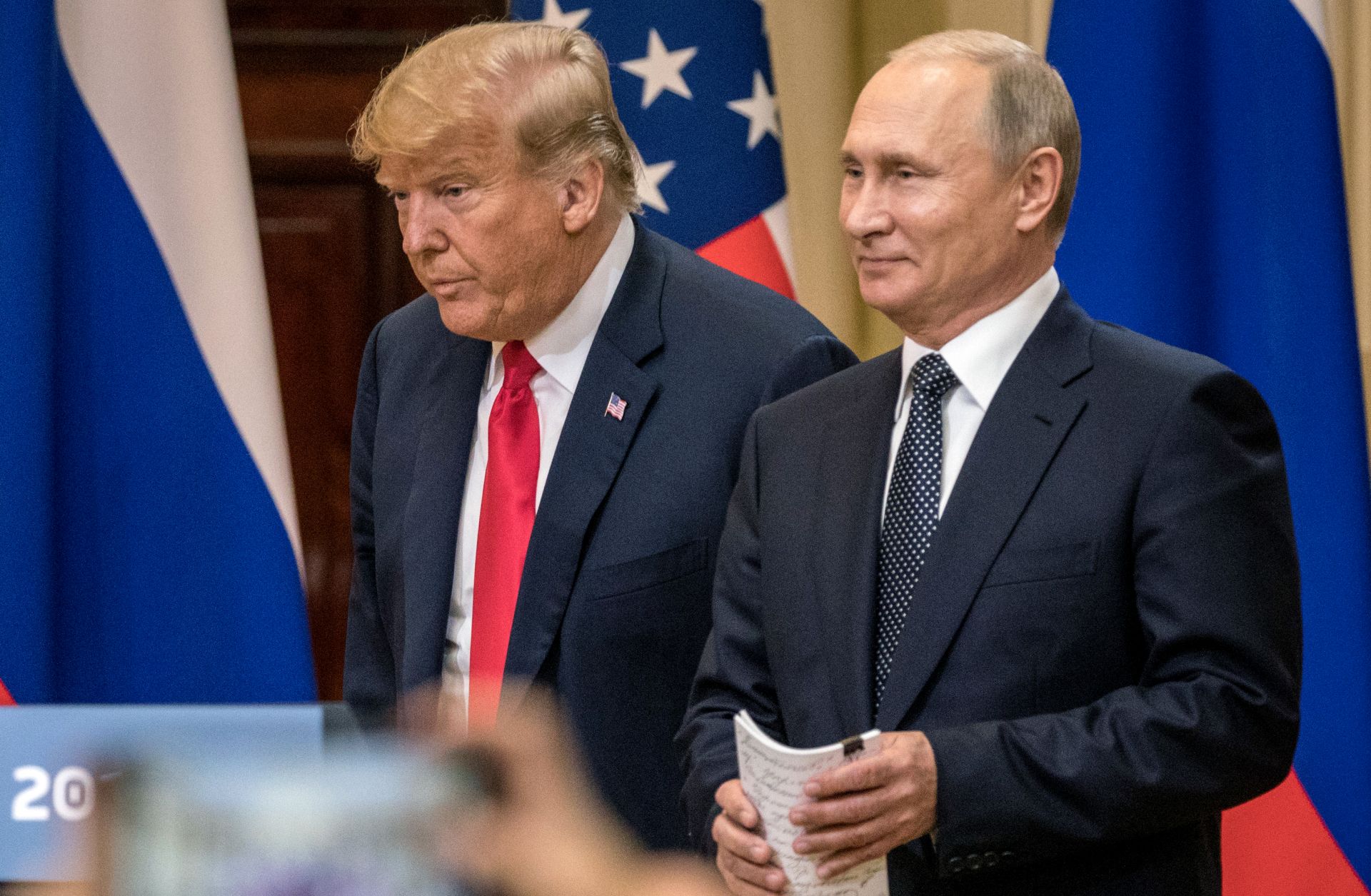 U.S. President Donald Trump (left) and Russian President Vladimir Putin arrive at a press conference after their summit on July 16, 2018, in Helsinki, Finland.