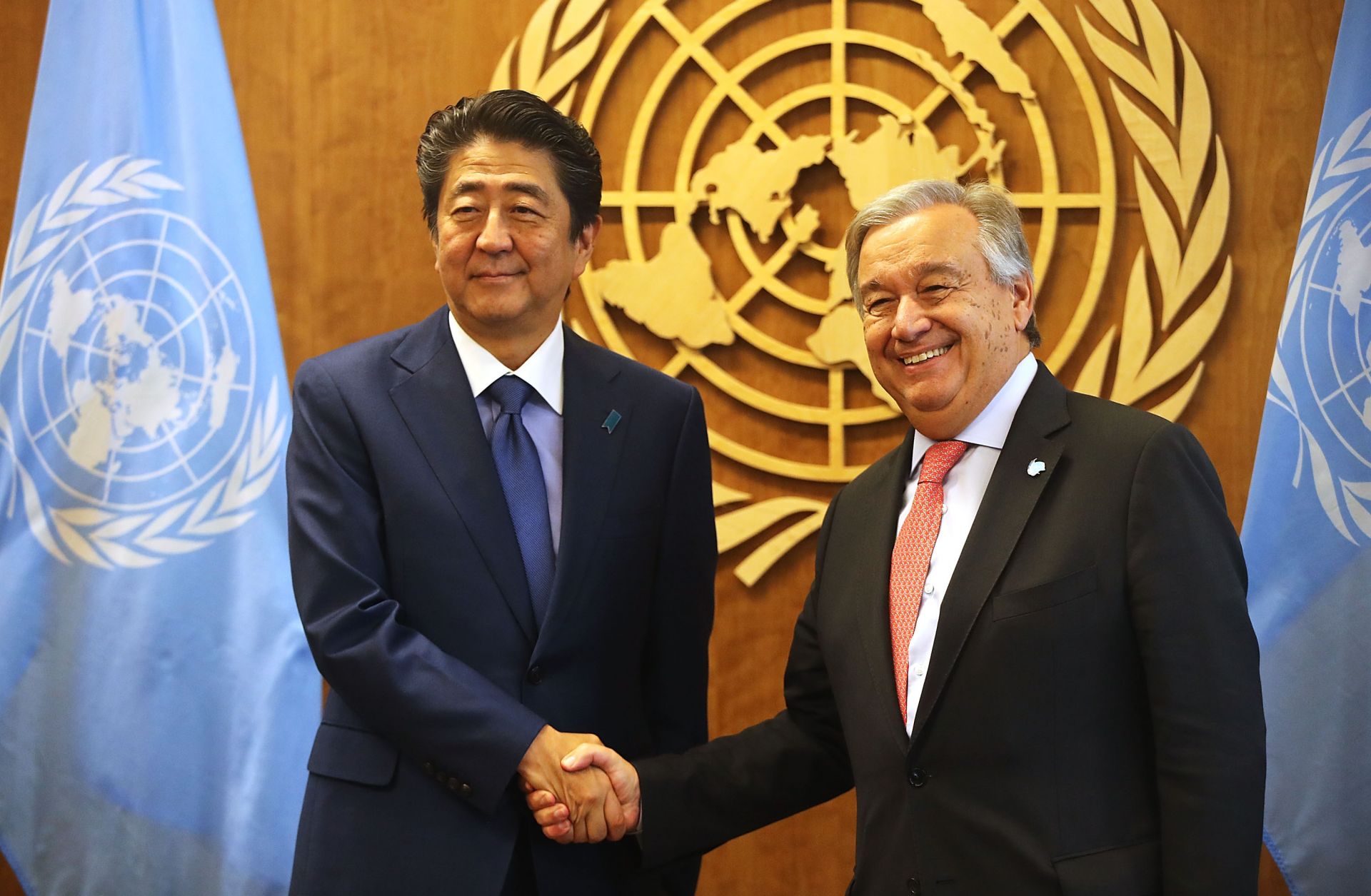 Then-Japanese Prime Minister Shinzo Abe shakes hands with the Secretary-General of the United Nations in New York City during the 73rd U.N. General Assembly on Sept. 25, 2018. 