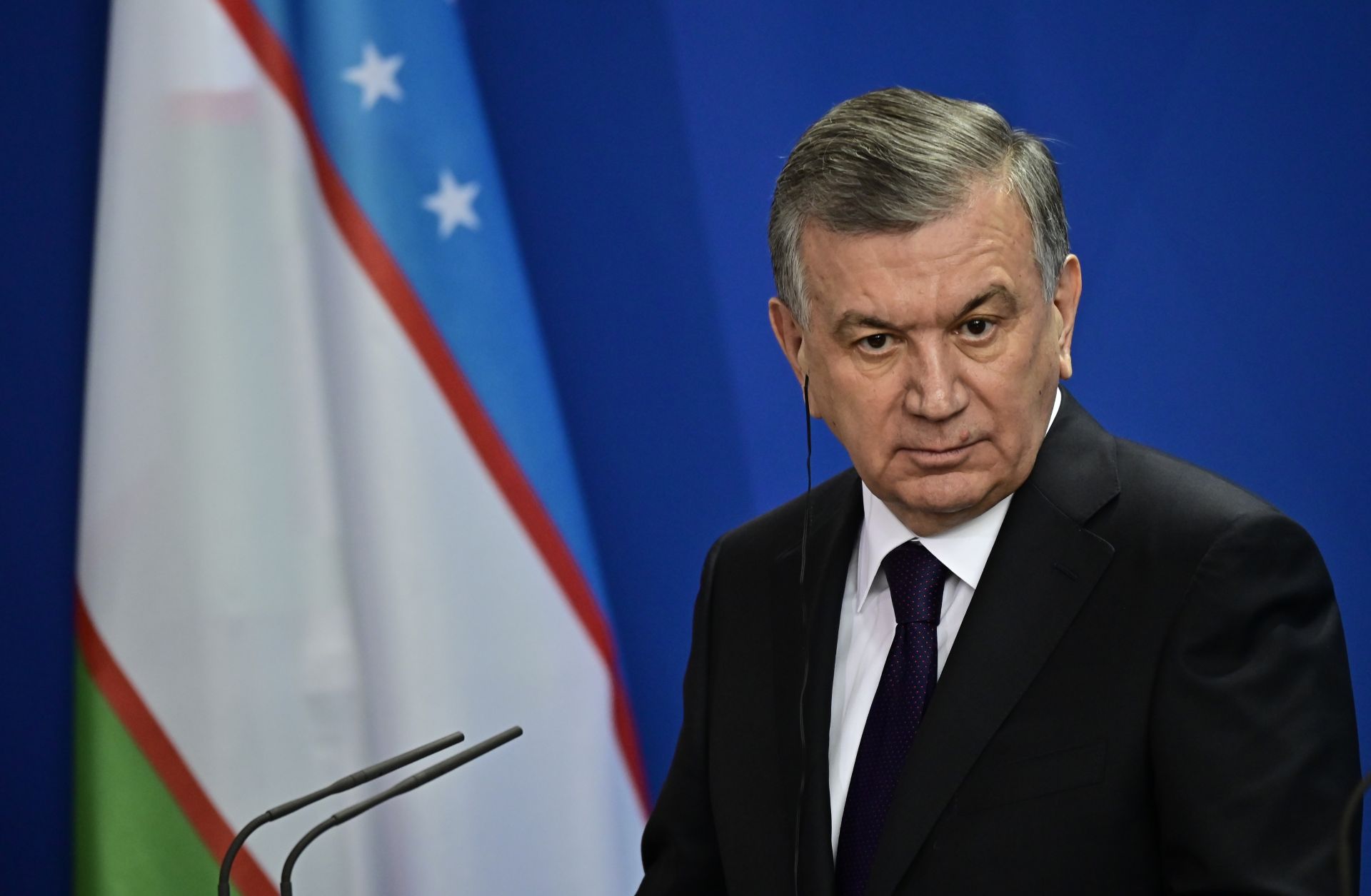 Uzbek President Shavkat Mirziyoyev listens during a joint press conference with German Chancellor Angela Merkel prior to a meeting on Jan. 21, 2019, in Berlin. 