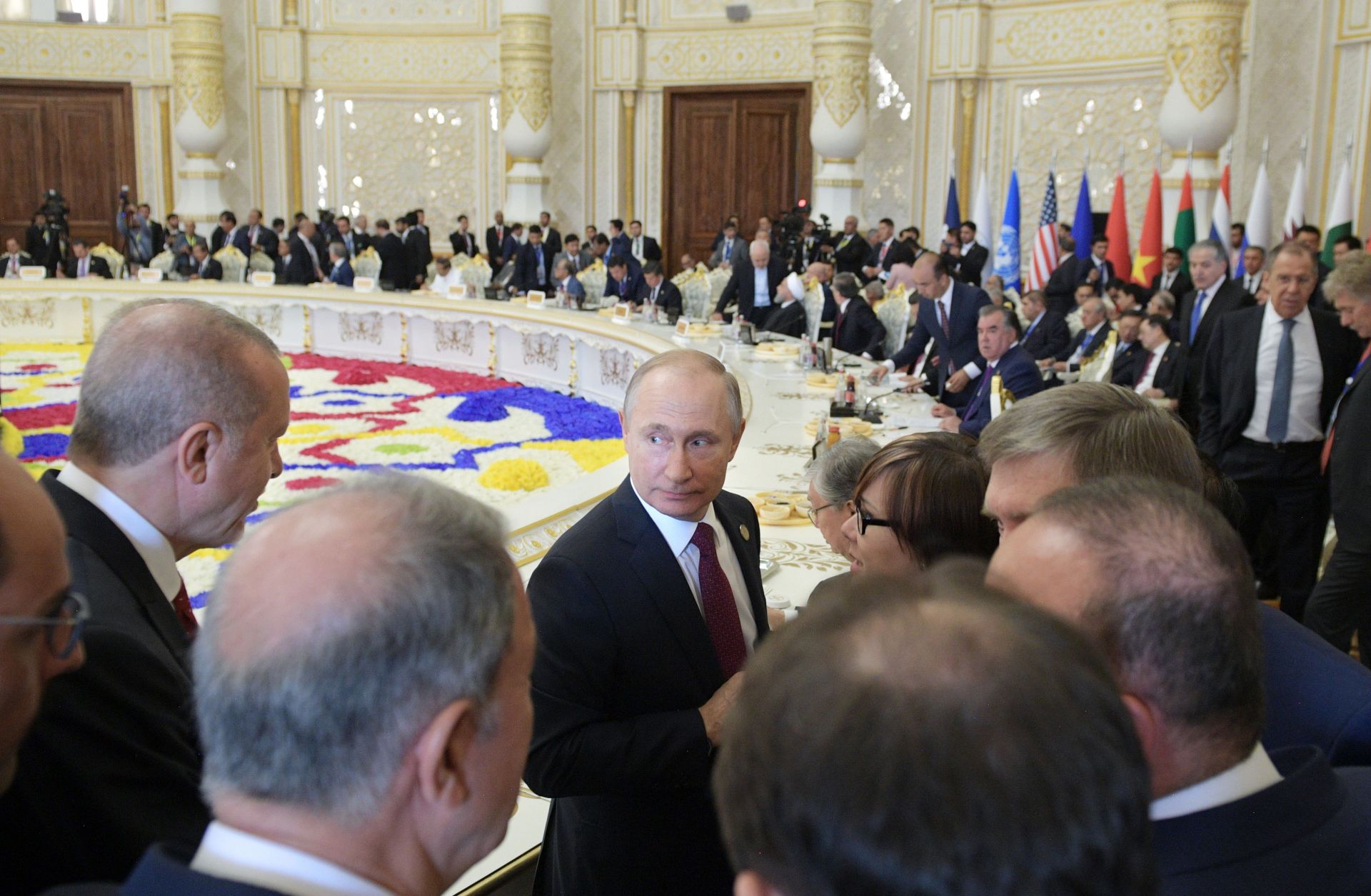 Russian President Vladimir Putin (center) listens to his Turkish counterpart Recep Tayyip Erdogan (left) at the 2019 Conference on Interaction and Confidence-Building Measures in Asia (CICA) in Dushanbe, Tajikistan. 