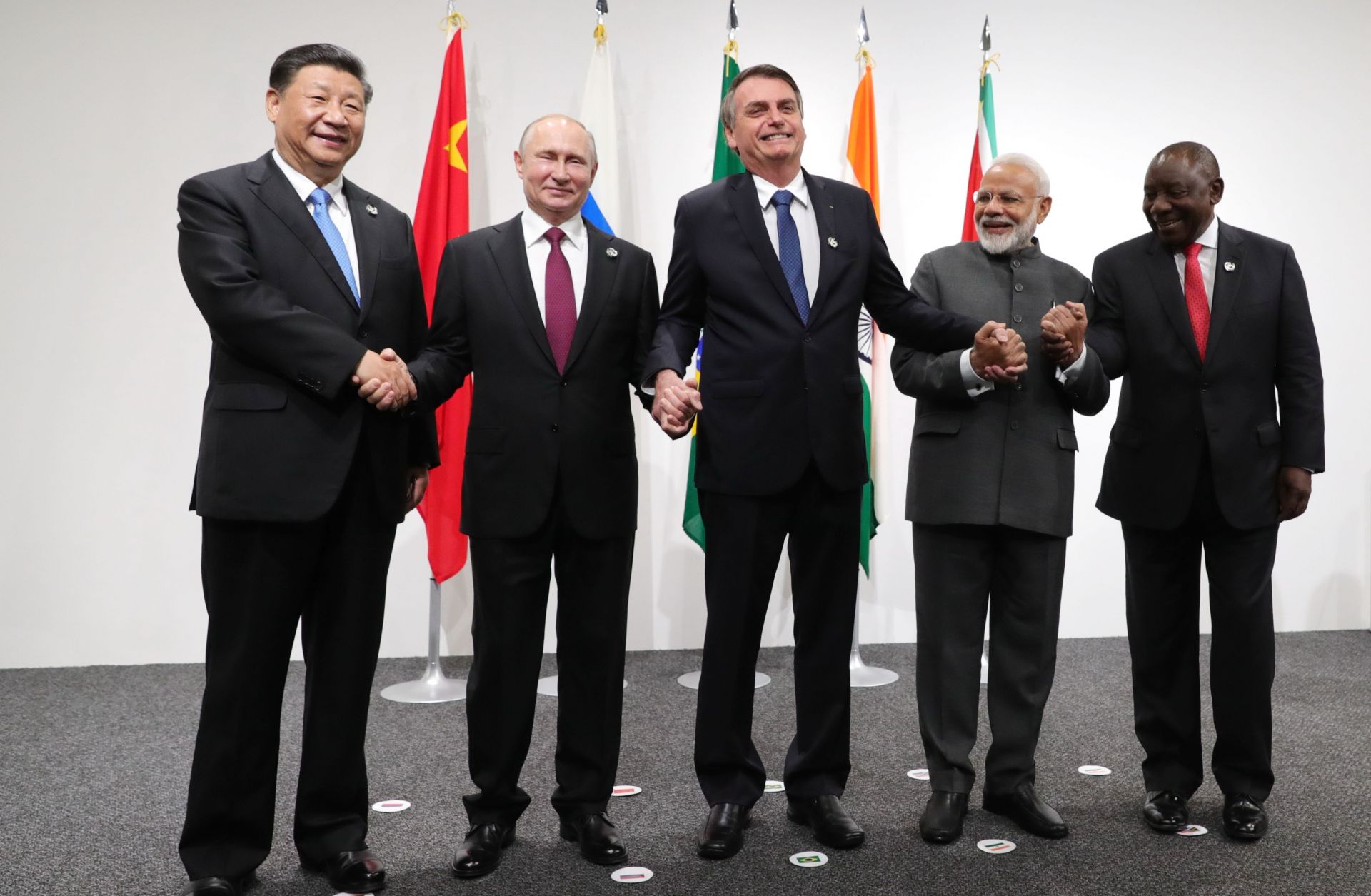 (From left) Chinese President Xi Jinping, Russian President Vladimir Putin, then-Brazilian President Jair Bolsonaro, Indian Prime Minister Narendra Modi and South African President Cyril Ramaphosa pose for a photo during the G-20 summit in Osaka, Japan, on June 28, 2019. 