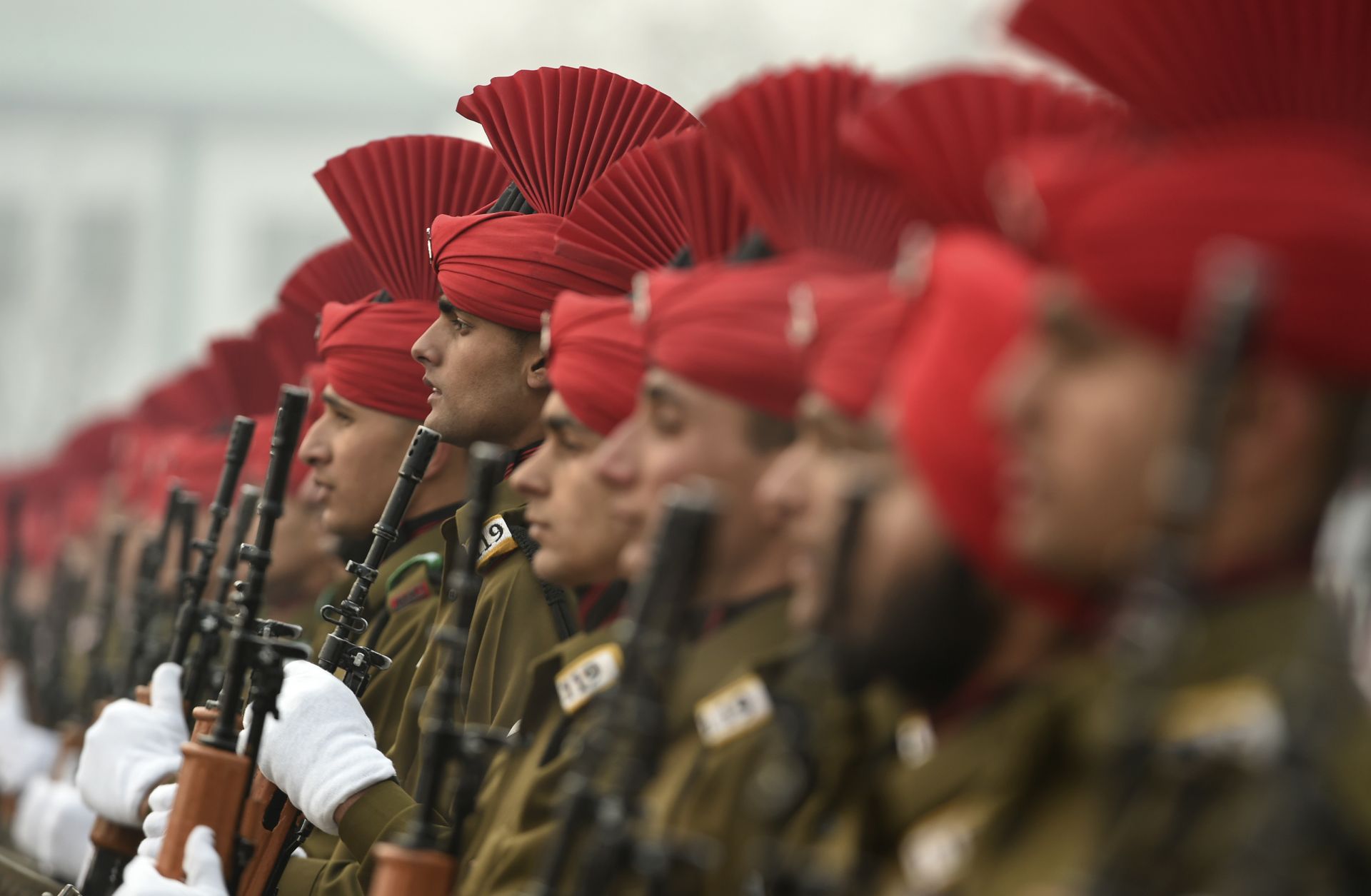 Newly recruited Indian army soldiers from the Jammu and Kashmir Light Infantry (JAKLI) stand in formation during a passing out parade at JAKLI army headquarters in Srinagar on Dec. 7, 2019. 