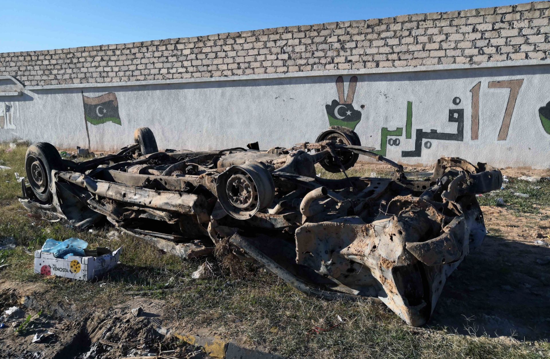 This Dec. 26, 2019, photo shows a damaged vehicle in the wake of an airstrike in Zawiya, 45 kilometers west of Tripoli.
