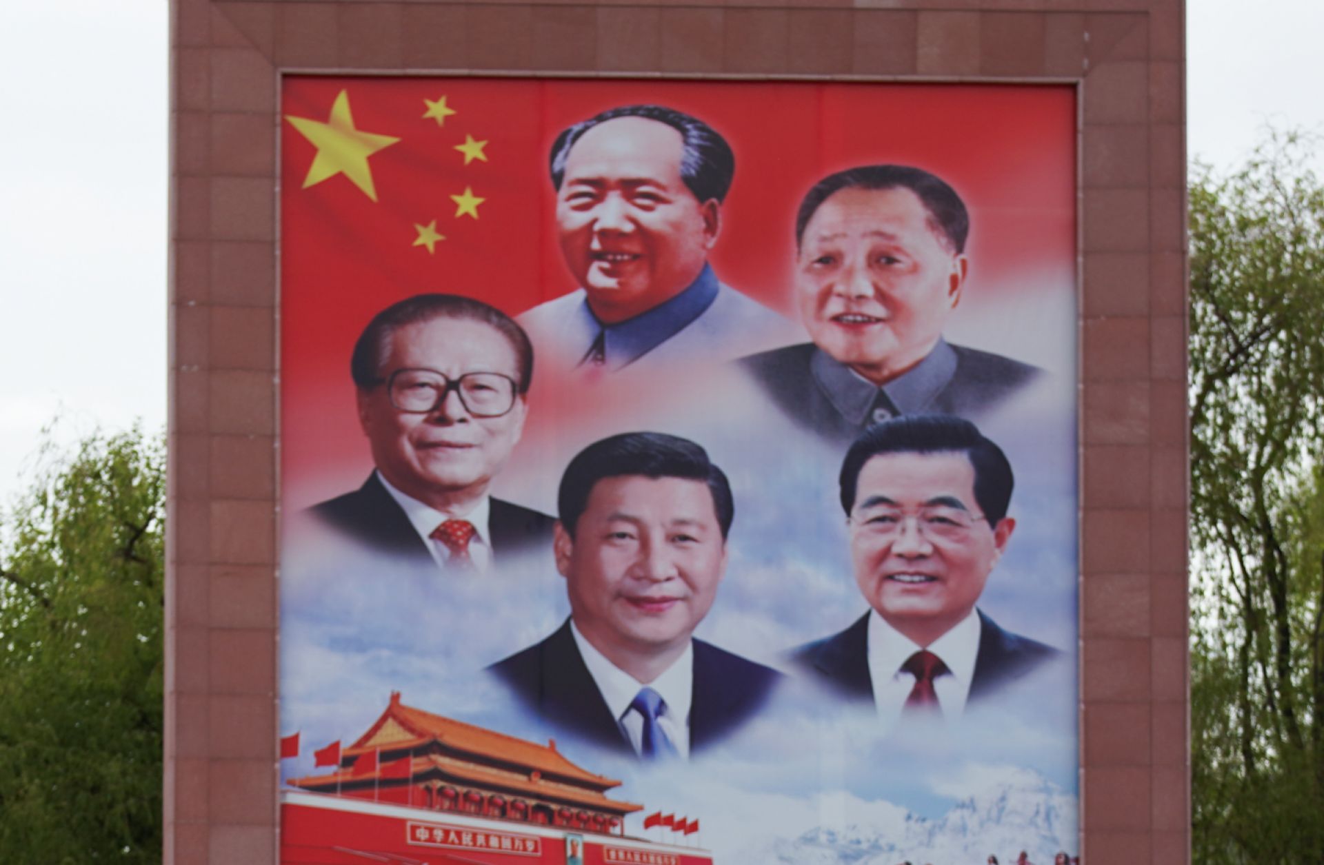 A large post with portraits of current Chinese Communist Party leader Xi Jinping (bottom center) and former leaders Mao Zedong, Deng Xiaoping, Jiang Zemin and Hu Jintao is seen in Lhasa, China on May 6, 2020. 