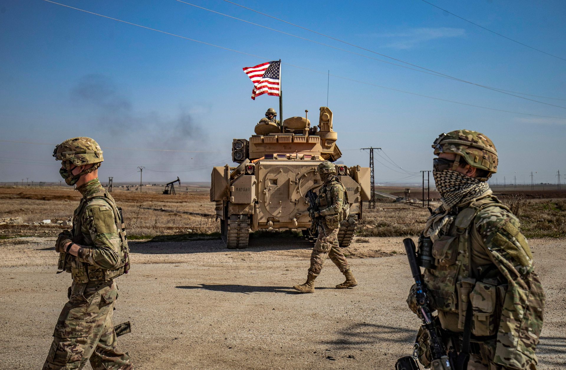U.S. soldiers patrol oil fields in northeast Syria on Feb. 13, 2021.