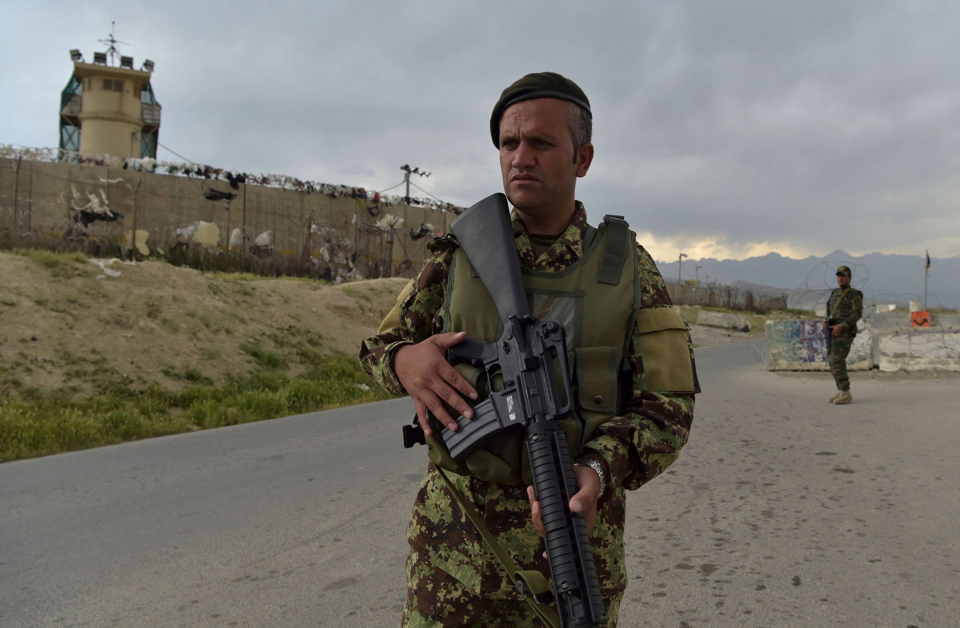 An Afghan soldier stands guard at a checkpoint outside a U.S. military base in Bagram, located roughly 50 kilometers north of Kabul, on April 29, 2021. 