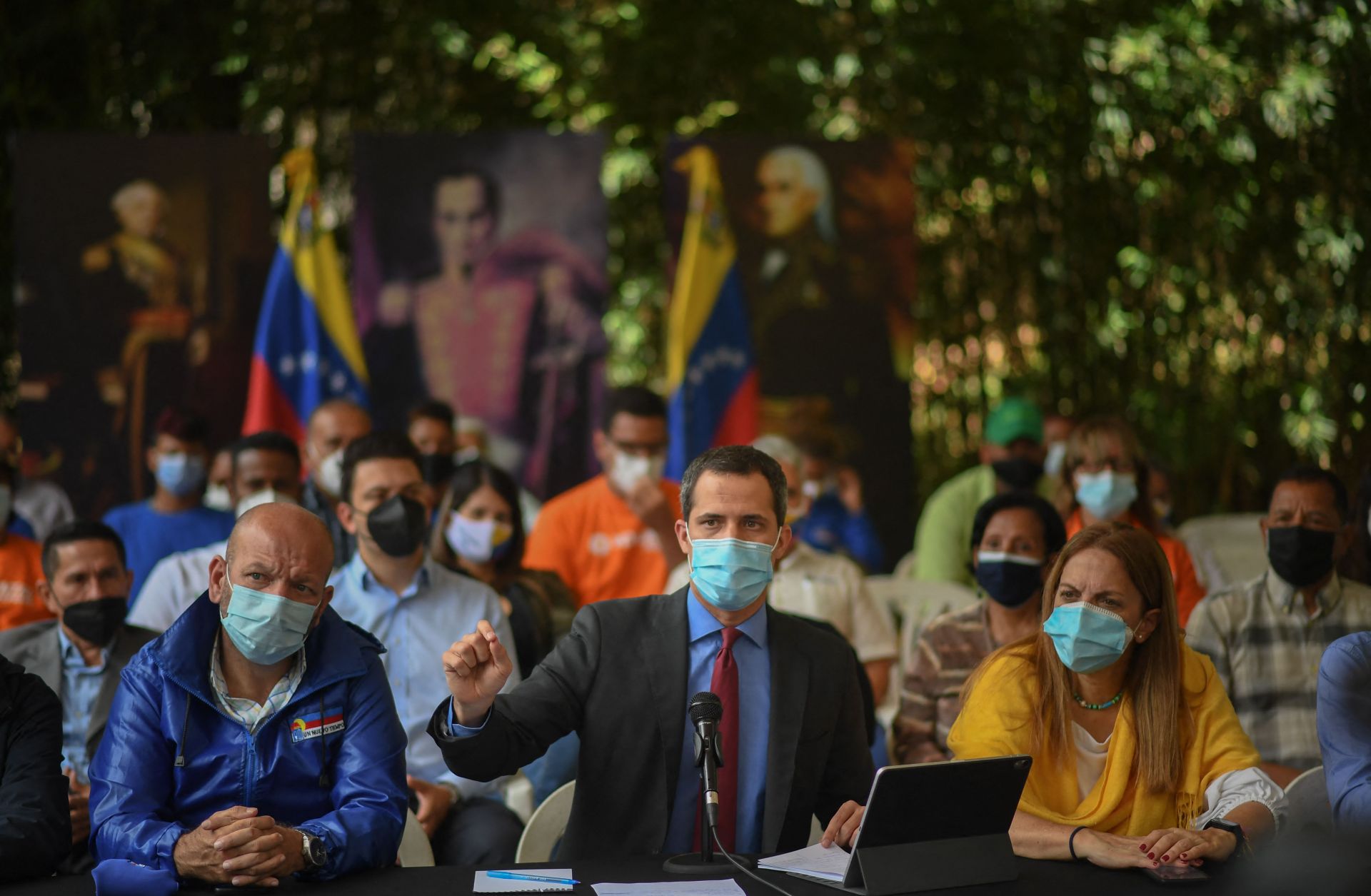 Venezuelan opposition leader Juan Guaido (center) speaks during a press conference at a park in Caracas on June 30, 2021. 