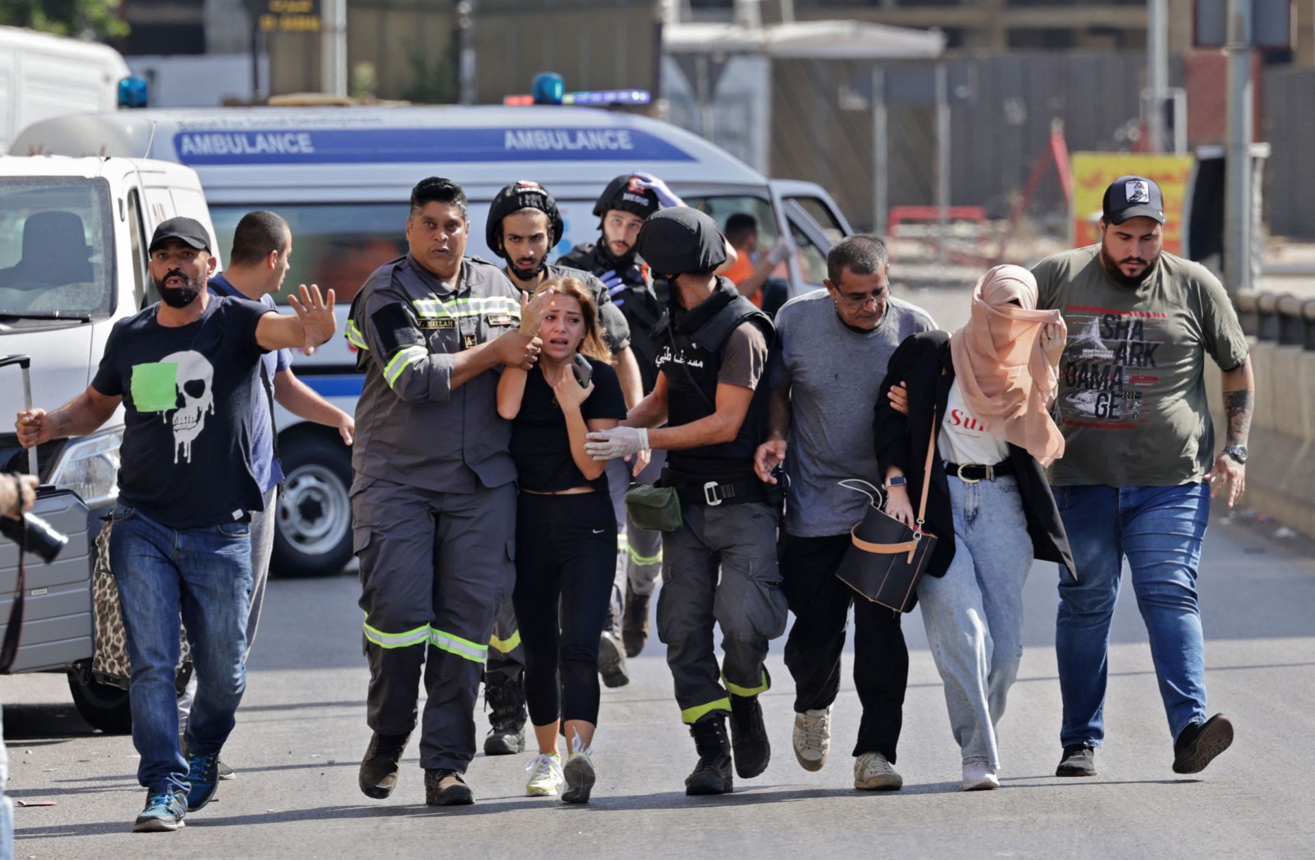 Lebanese medics help evacuate civilians during clashes in the Tayouneh area of Beirut on Oct. 14, 2021. Lebanese medics help evacuate civilians during clashes in the Tayouneh area of Beirut on Oct. 14, 2021.