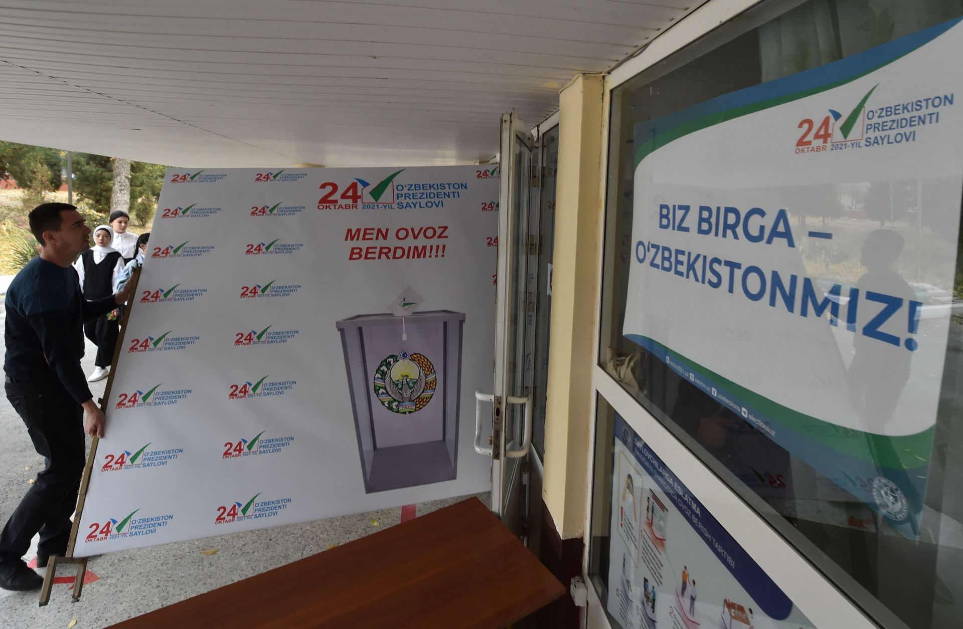 Members of a local election commission prepare a polling station in Tashkent, Uzbekistan, on Oct. 21, 2021, ahead of the country’s presidential election. 