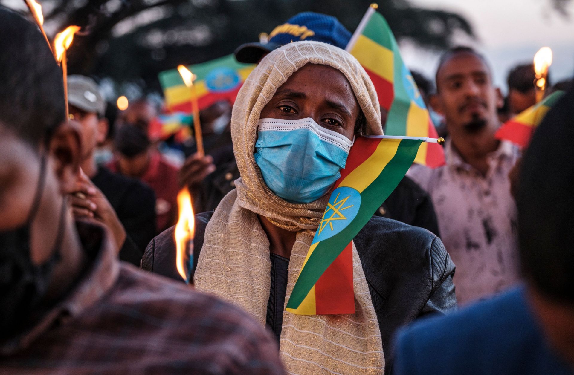 A woman holds a candle during a memorial service for the victims of the Tigray conflict in Addis Ababa, Ethiopia, on Nov. 3, 2021. 