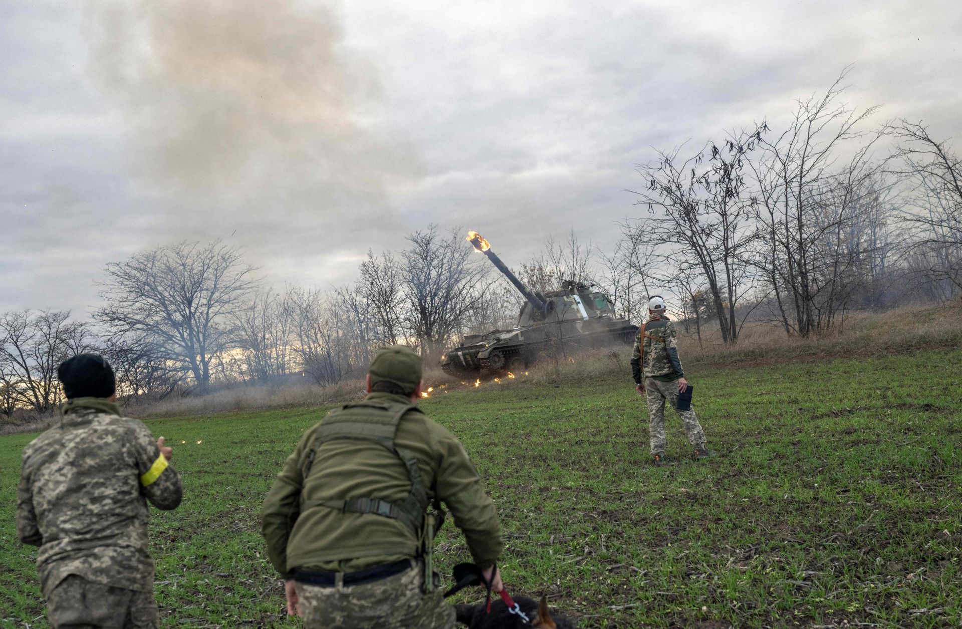 Ukrainian artillery unit members fire toward the city of Kherson in southern Ukraine on Oct. 28, 2022.