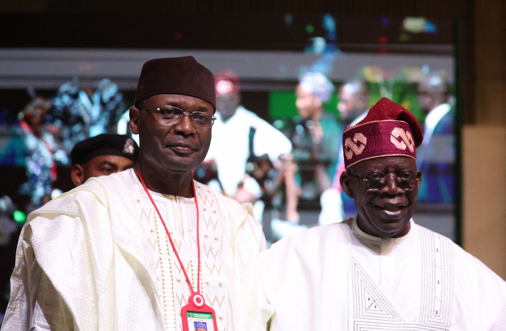Nigerian President-elect Bola Tinubu (right) and the chairman of the country's Independent National Election Commission (INEC), Yakubu Mahmood, look on during a ceremony in Abuja on March 1, 2023. Nigerian President-elect Bola Tinubu (right) and the chairman of the country's Independent National Election Commission (INEC), Yakubu Mahmood, look on during a ceremony in Abuja on March 1, 2023.